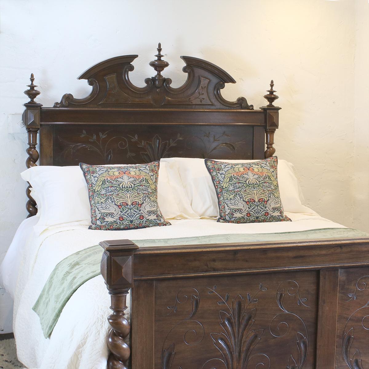 A superb Renaissance style bed in walnut with carved panels, barley twist columns, decorative pediment and turned finials. 

This bed accepts a British King size or American Queen size 5ft wide (60 inches or 150cm) base and mattress set.

The