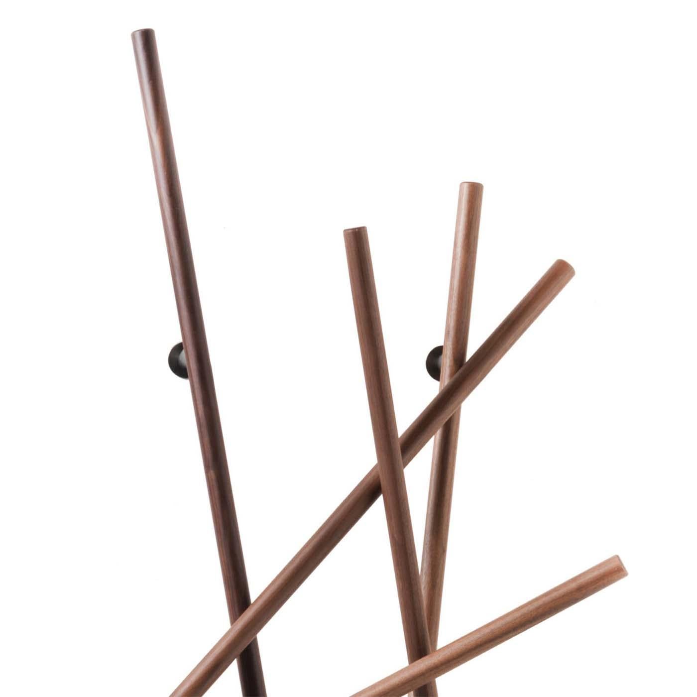 Coatrack walnut rods all in solid walnut 
wood with blackened iron supports.

 