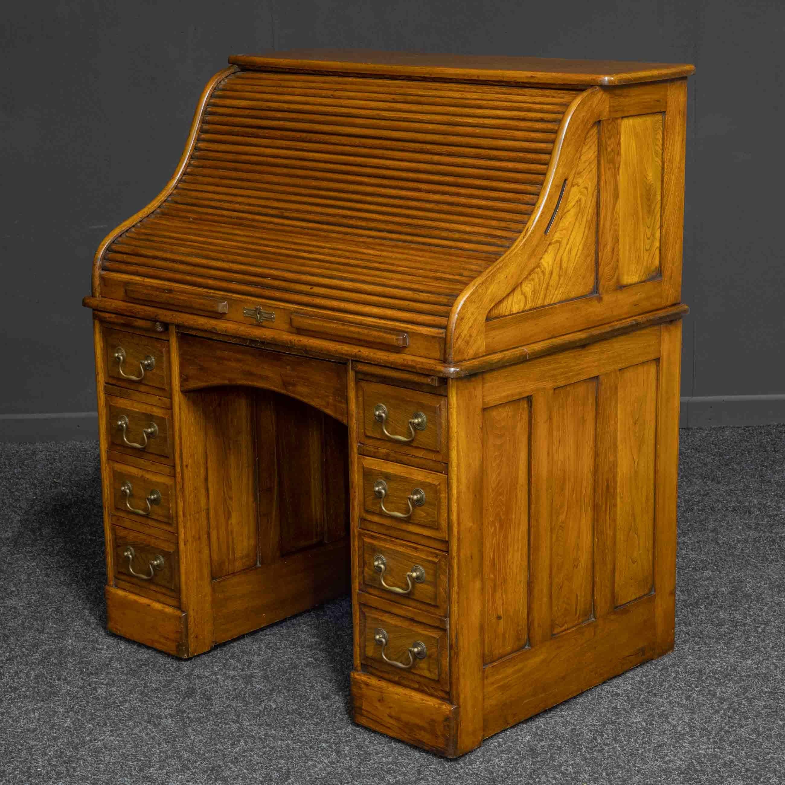 A small and attractive walnut roll top desk with a stamp to the central drawer top - Gillows London. Whilst this is a well made piece we think the attribution to Gillows is suspicious and likely done by a unscrupulous previous seller in the desk's