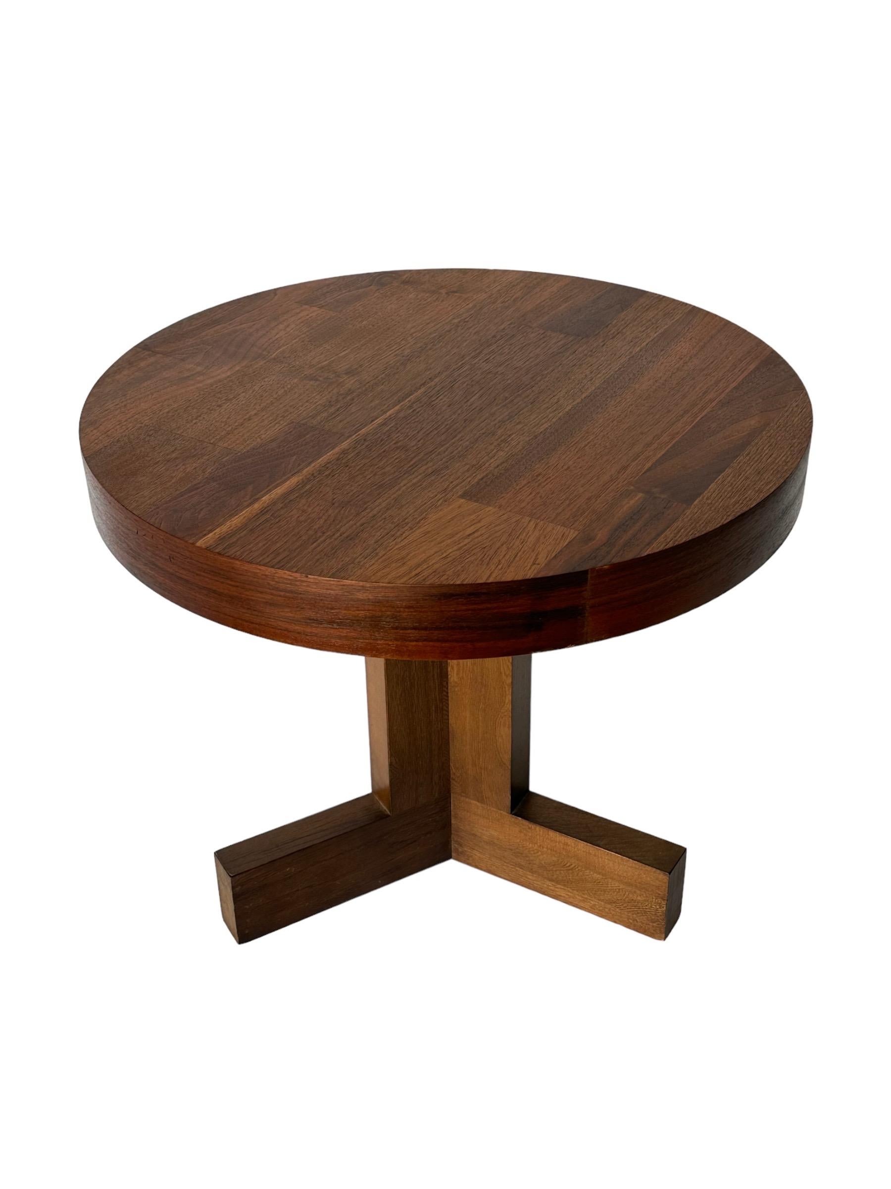 Uncommon round Lane side table on tripod base. Elegant and simple, yet solid and impactful in its design. Walnut top and banded edge have been cleaned and oiled to highlight warm nuance in tones and grain pattern. Large enough for use as a single