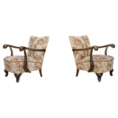 Walnut sculptural armchairs featuring their original floral upholstery, CZ 1930s
