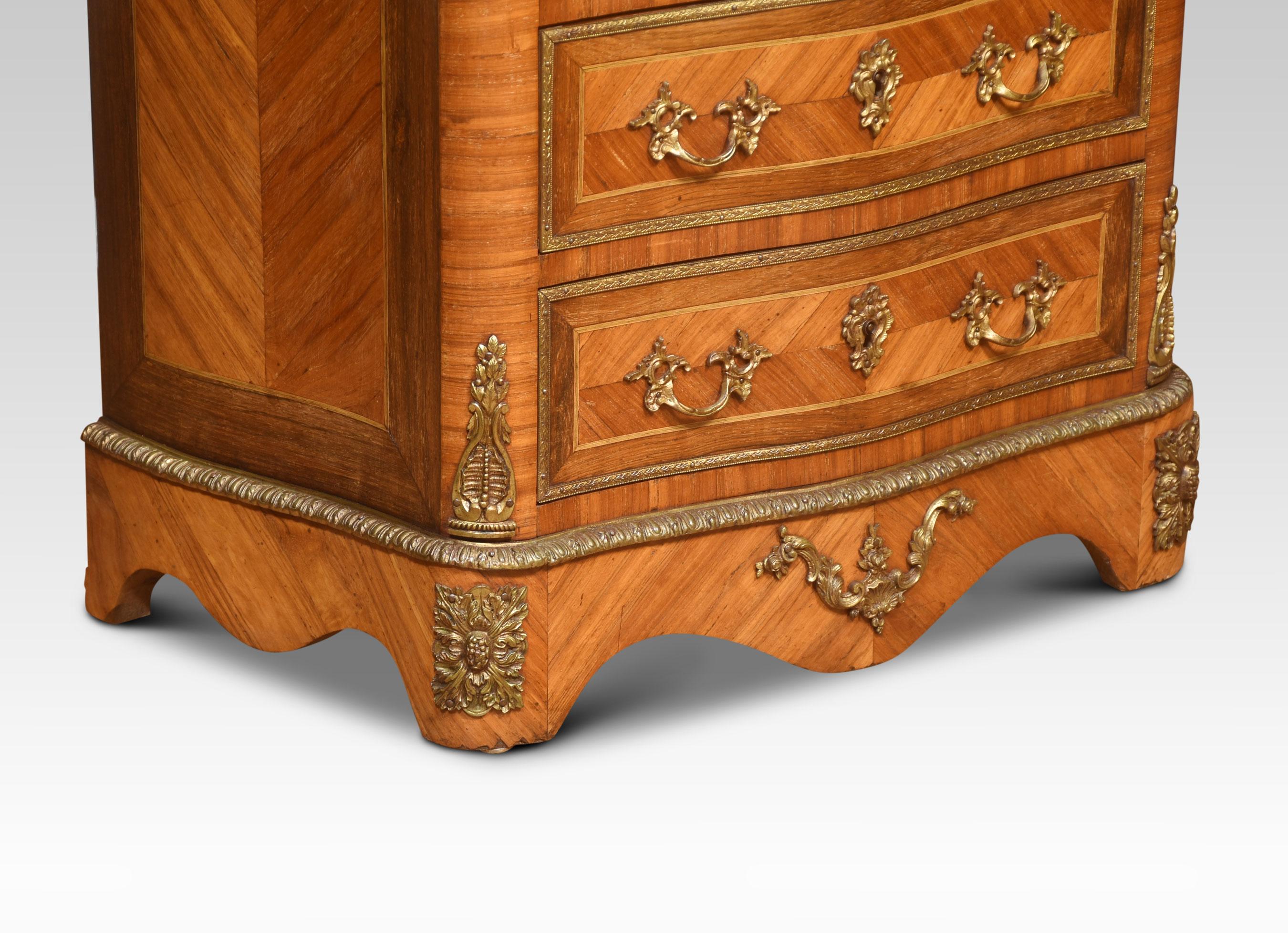A French secretaire a’ abbattant, in the Louis XVI taste, the well-figured top, above conforming serpentine front over a fall front secretaire, enclosing drawers and shelf with a green tooled leather writing surface, above four further drawers, all