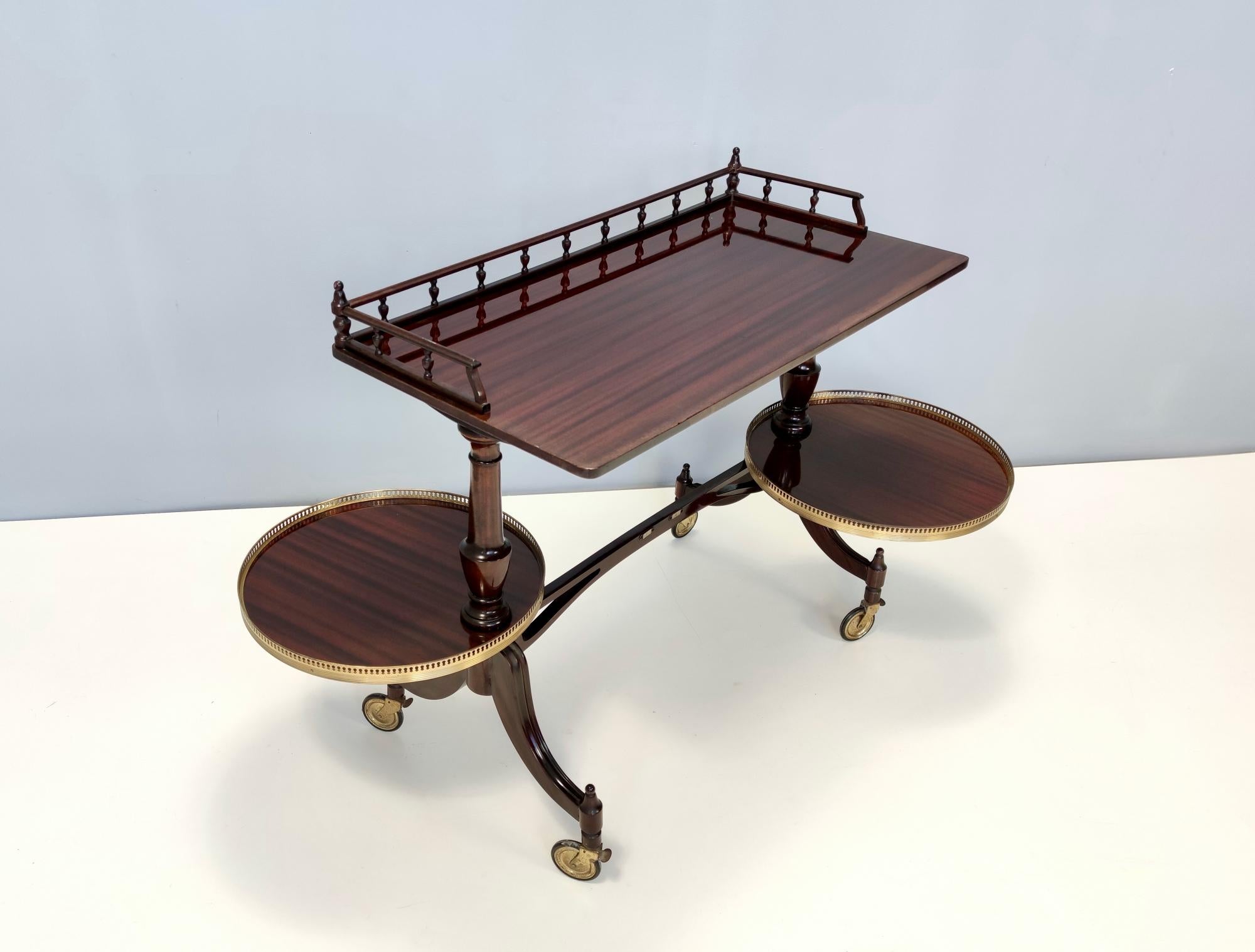 Made in Italy, 1950s.
This serving cart / console table features a walnut frame with brass details and casters.
It is a vintage piece therefore it might show slight traces of use, but it can be considered as in excellent original