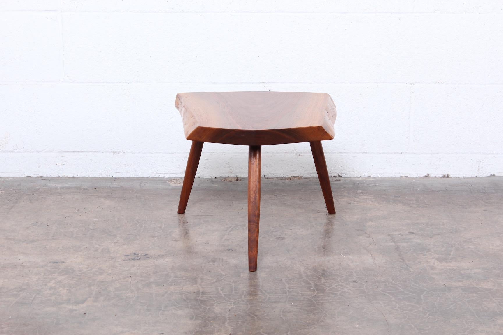 Walnut side table by George Nakashima signed and dated 1989.
    