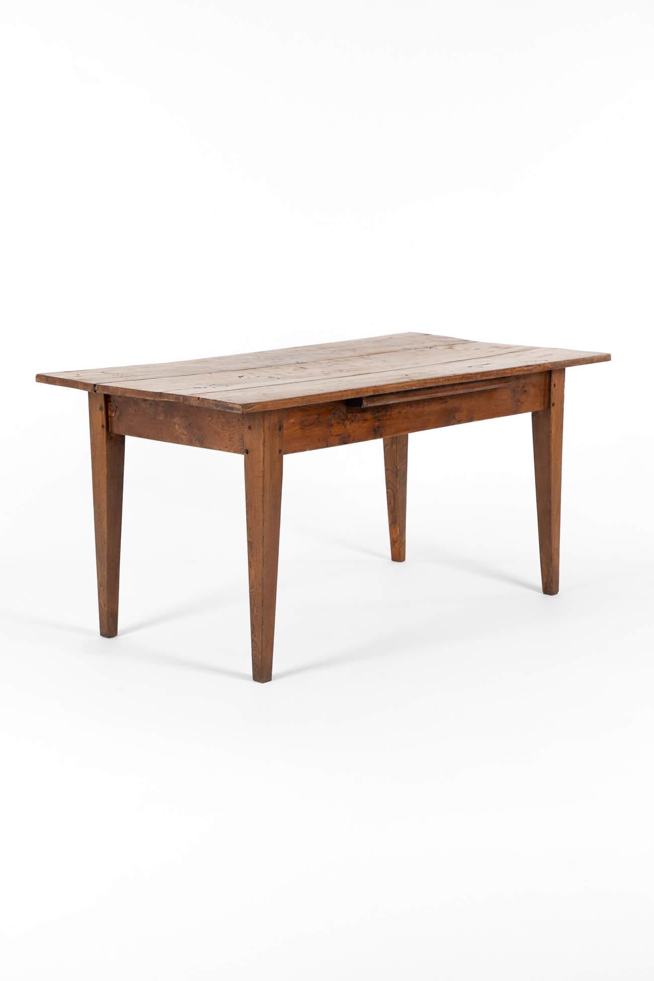 A small French side table in walnut with a charming central breadboard that extends from beneath the apron.

The triple plank walnut top has an exquisite grain and colour.

Raised on four pegged tapered legs.

France, circa 1860.

TOTAL

L: 148 CM