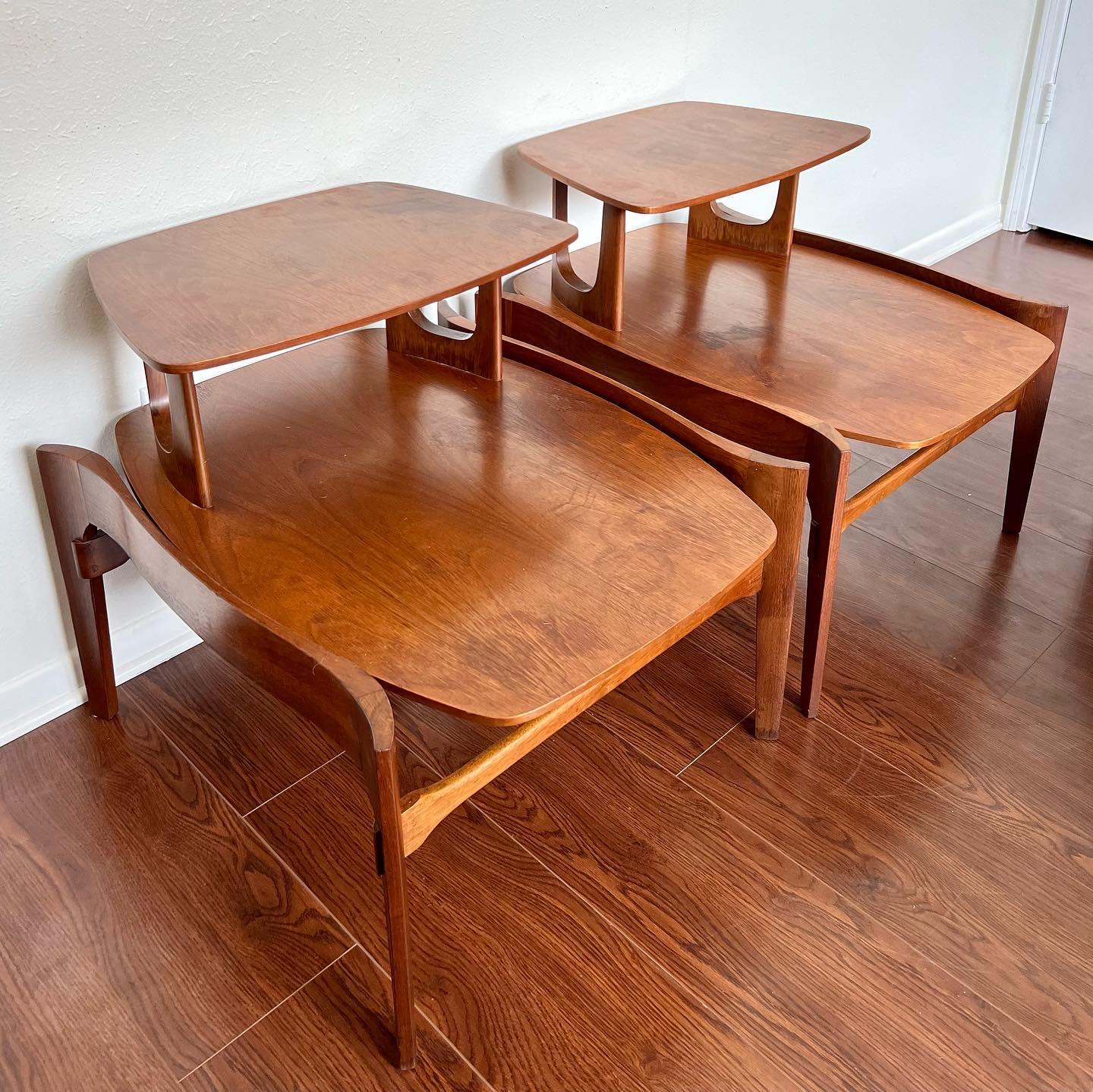 This listing is just for the side tables. 

Mid-Century Modern iconic table set. A stunning contoured walnut frame suspends a gorgeous piece of original travertine for the coffee table. Stamped “Made in Italy.”The side tables are solid walnut, and