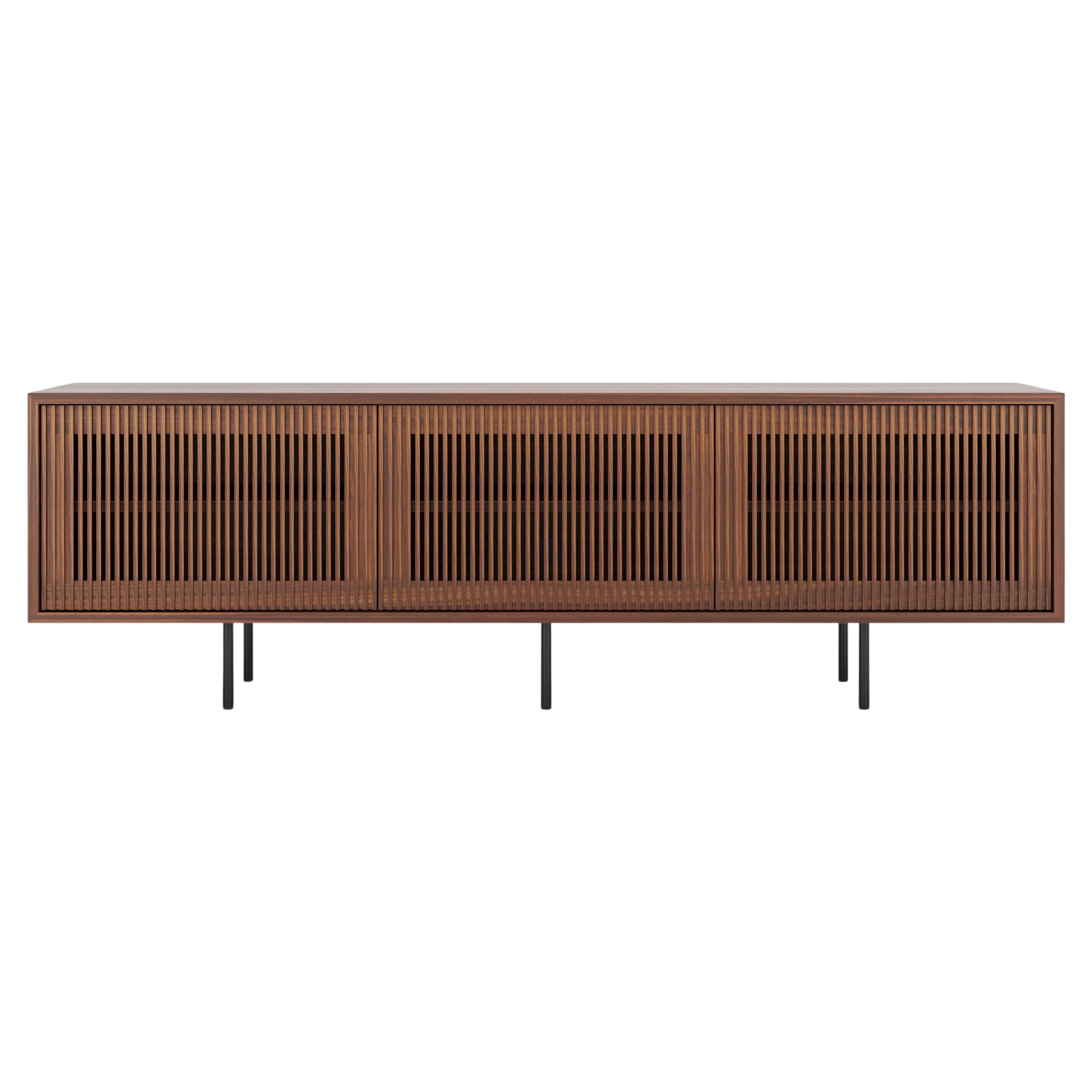 Walnut sideboard TV stand with three slatted doors in mid century modern style