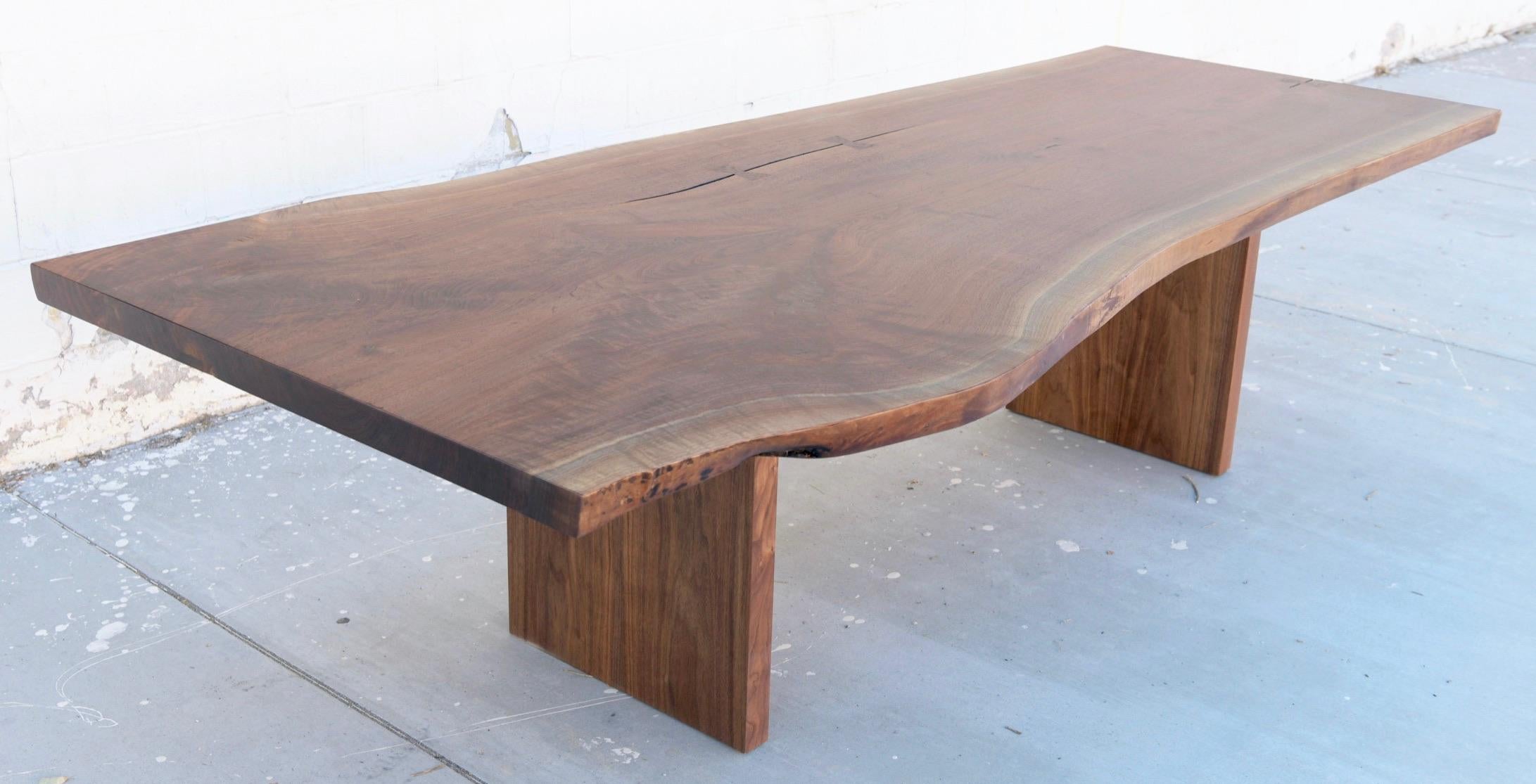 This custom walnut slab dining table is seen here in 108