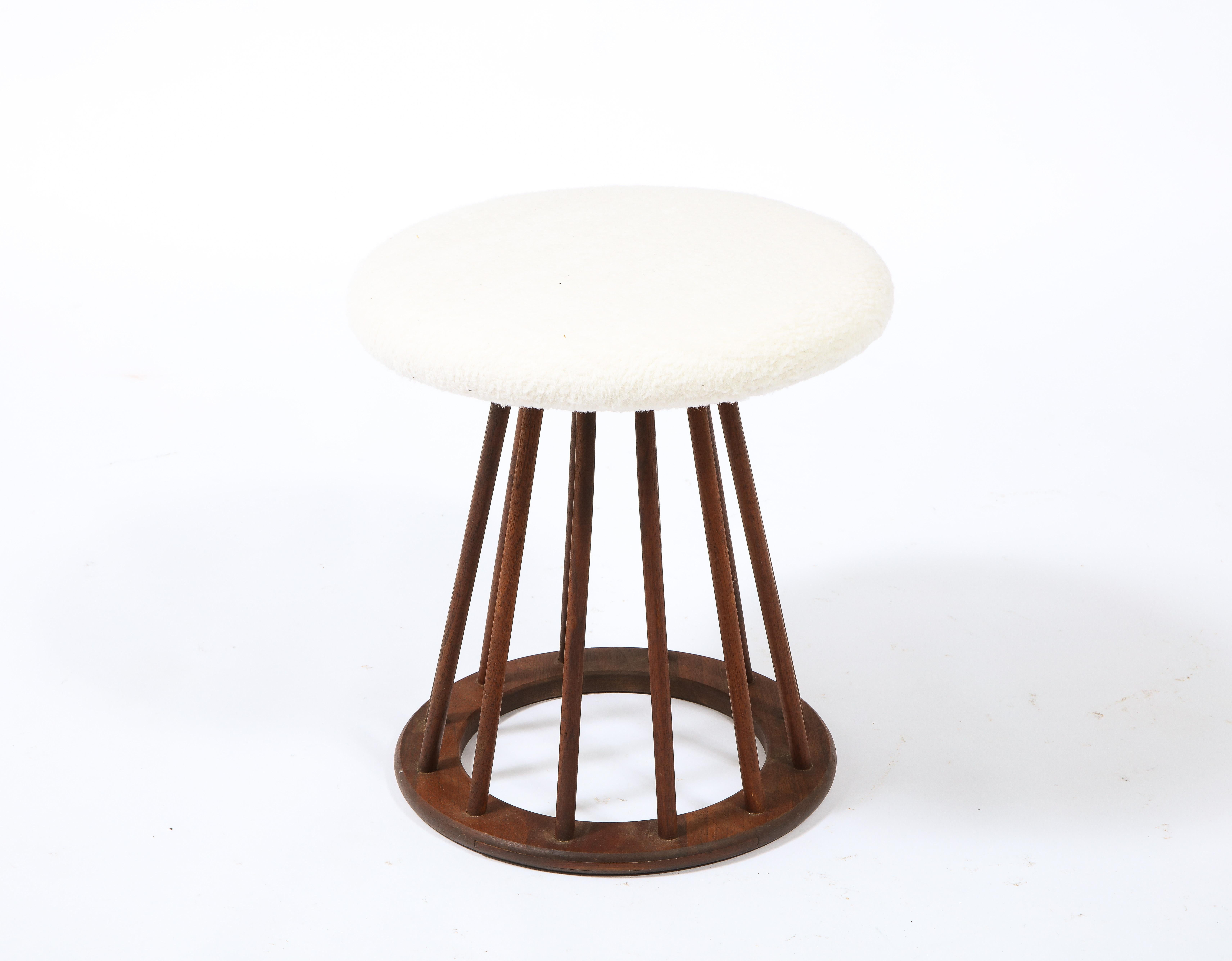 A set of spindle stools by Arthur Umanoff in walnut, upholstered in wool. Priced by the pair. Two pairs available. 