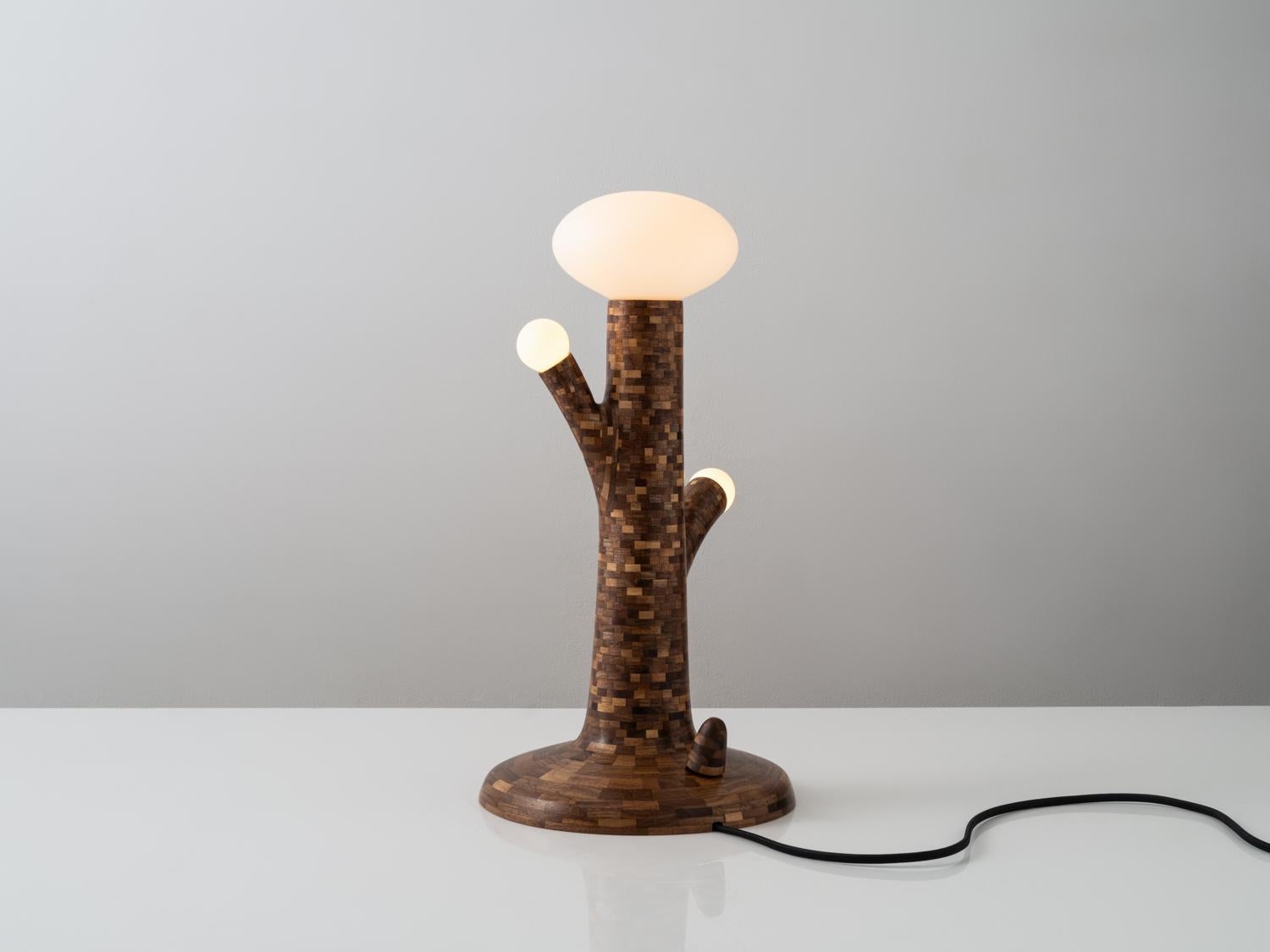 The beauty of Richard’s signature STACKED style is based entirely in the process. This lamp, made of Salvaged Walnut features an Oval light at the top along with two round lights branching off the main stem. This lamp, as with every STACKED object