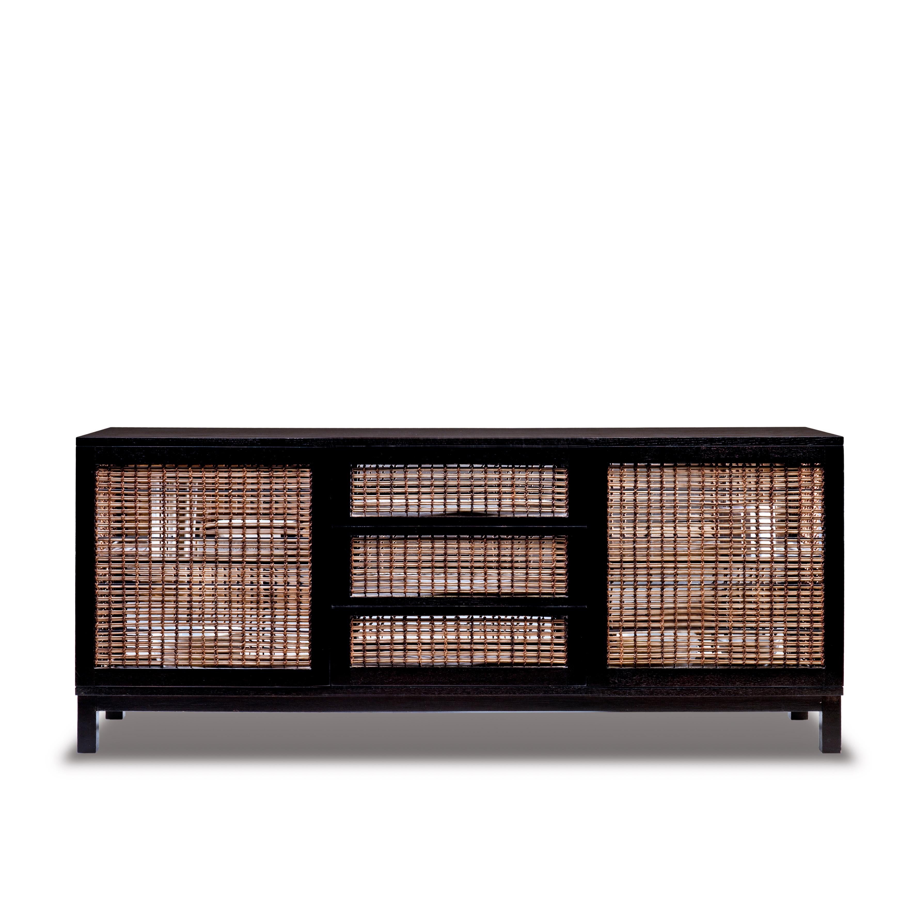 Walnut suzy wong buffet cabinet by Kenneth Cobonpue.
Materials: Lampakanai, rattan, walnut. 
Also available in maple. 
Dimensions: 50 cm x 180 cm x H 77 cm

Woven panels create a feeling of intimacy as you and your guests indulge in