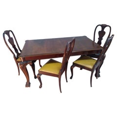 Walnut table with chairs in the style of King George III