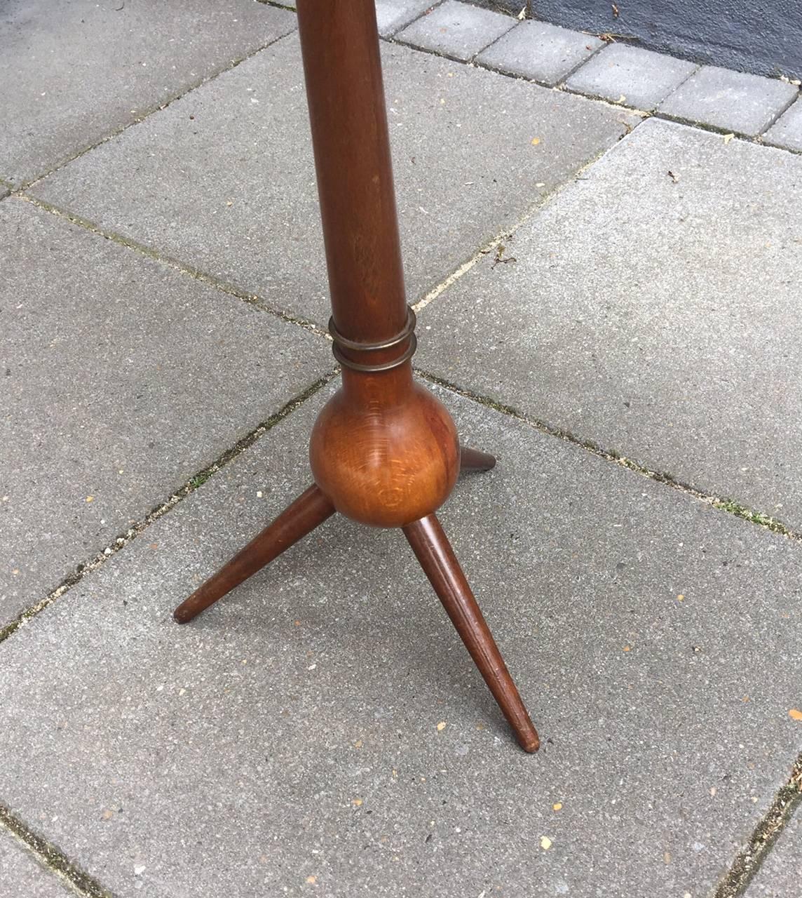 Very rare side or tray table designed by the Danish Architect Severin Hansen in 1956. It features a walnut construction with the characteristic brass rings and is loosely fitted with a Tray in lacquered teak veneer. This tray, although a decent
