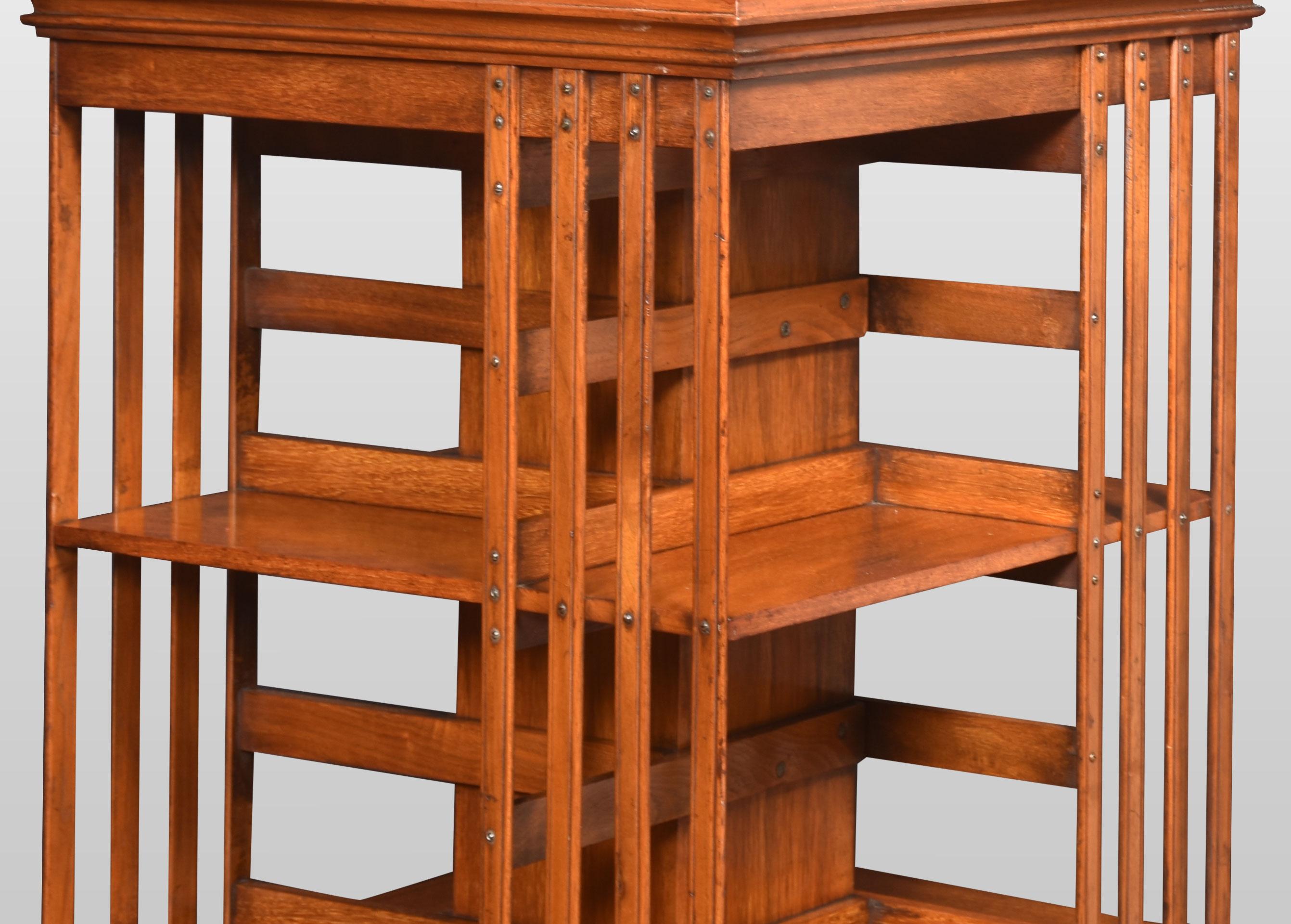 Large walnut three-tier revolving bookcase, the square top above an arrangement off graduated shelves raised up on cruciform base with brass caps and ceramic castors.
Dimensions
Height 44 inches
Width 21 inches
Depth 21 inches.