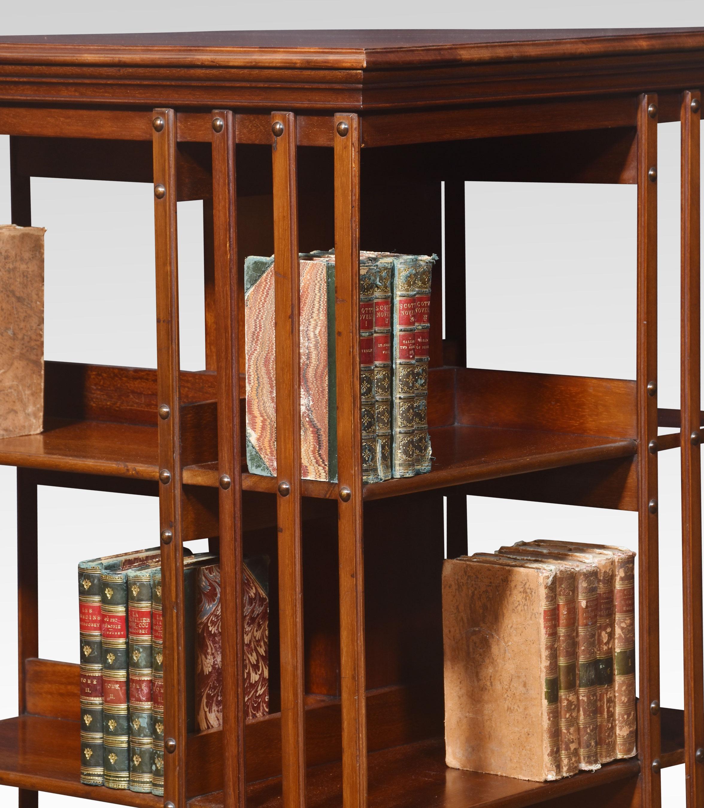 Large walnut three-tier revolving bookcase, the square top above an arrangement off graduated shelves raised up on cruciform base with ceramic castors.
Dimensions
Height 48 Inches
Width 24 Inches
Depth 24 Inches