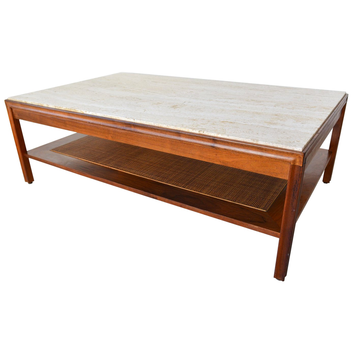 Beautiful walnut, travertine and cane coffee table by Gerry Zanck, circa 1957. Lower shelf with cane in perfect condition, beautiful walnut grain and travertine in good condition. (One small chip, see photo 10, not highly noticeable but we could