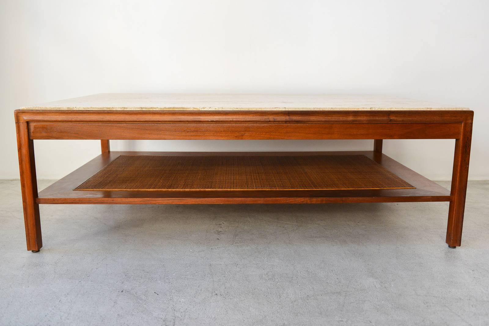 Beautiful walnut, travertine and cane coffee table by Gerry Zanck, circa 1957. Lower shelf with cane in perfect condition, beautiful walnut grain and travertine in good condition. (One small chip, see photo 10, not highly noticeable but we could