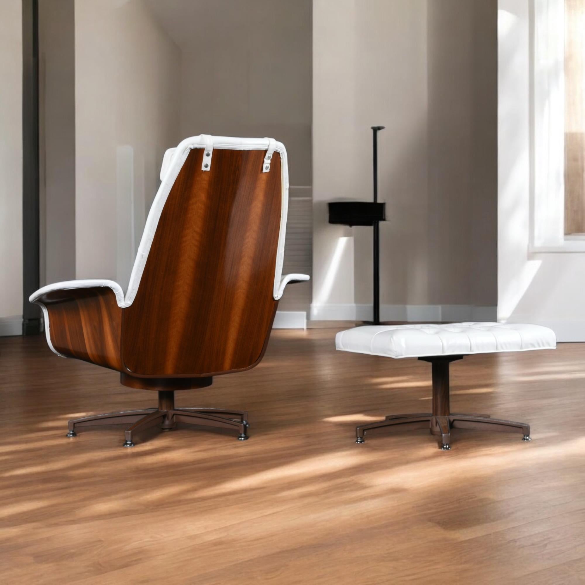 This listing is for ONE chair with ottoman. The second chair has been sold.

Beautifully restored Mid-Century Modern white lounge chair with ottomans designed in the manner of George Mulhauser's 