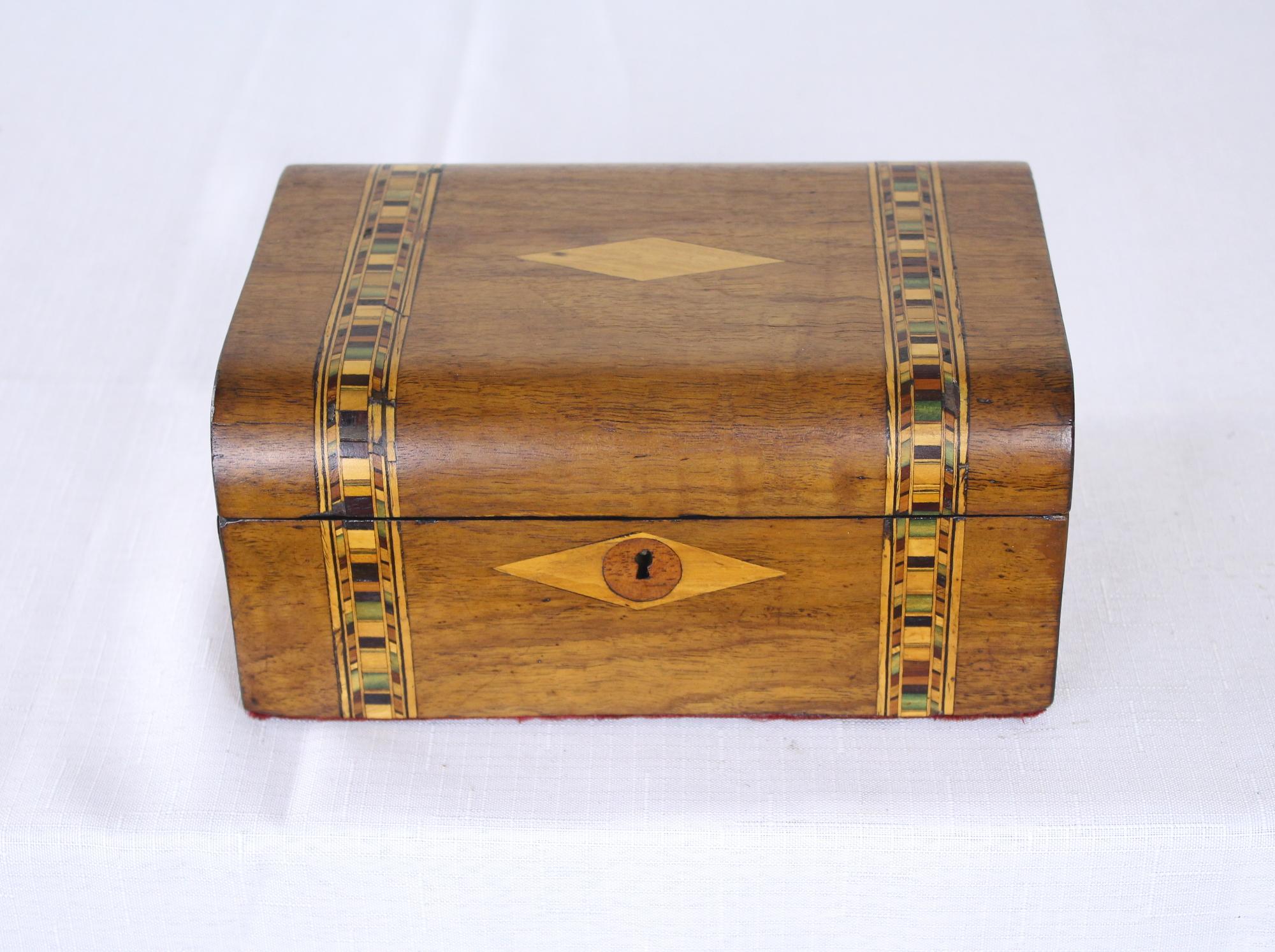 A walnut Tumbridgeware jewelry box. Tumbridgeware being characterized as a form of decoratively inlaid woodwork, typically in the form of boxes, that is characteristic of Tonbridge and the spa town of Royal Tunbridge Wells in Kent in the 18th and