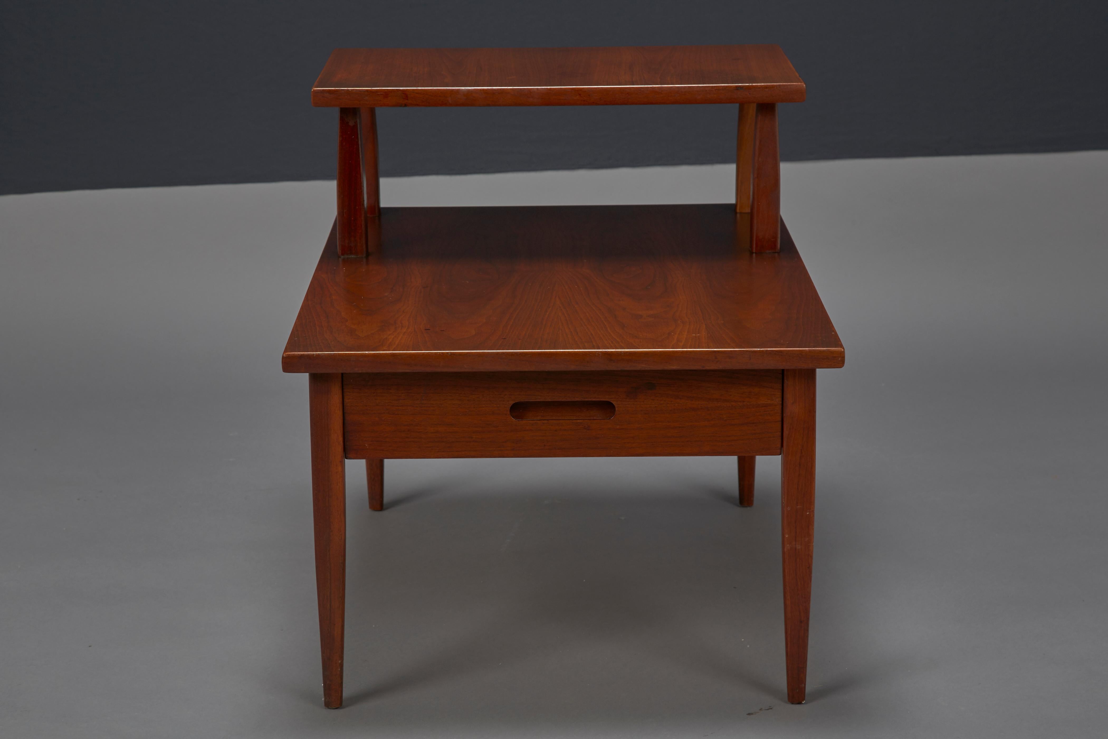 Mid-Century Modern walnut two-tiered side table attributed to T.H. Robsjohn-Gibbings for Widdicomb.