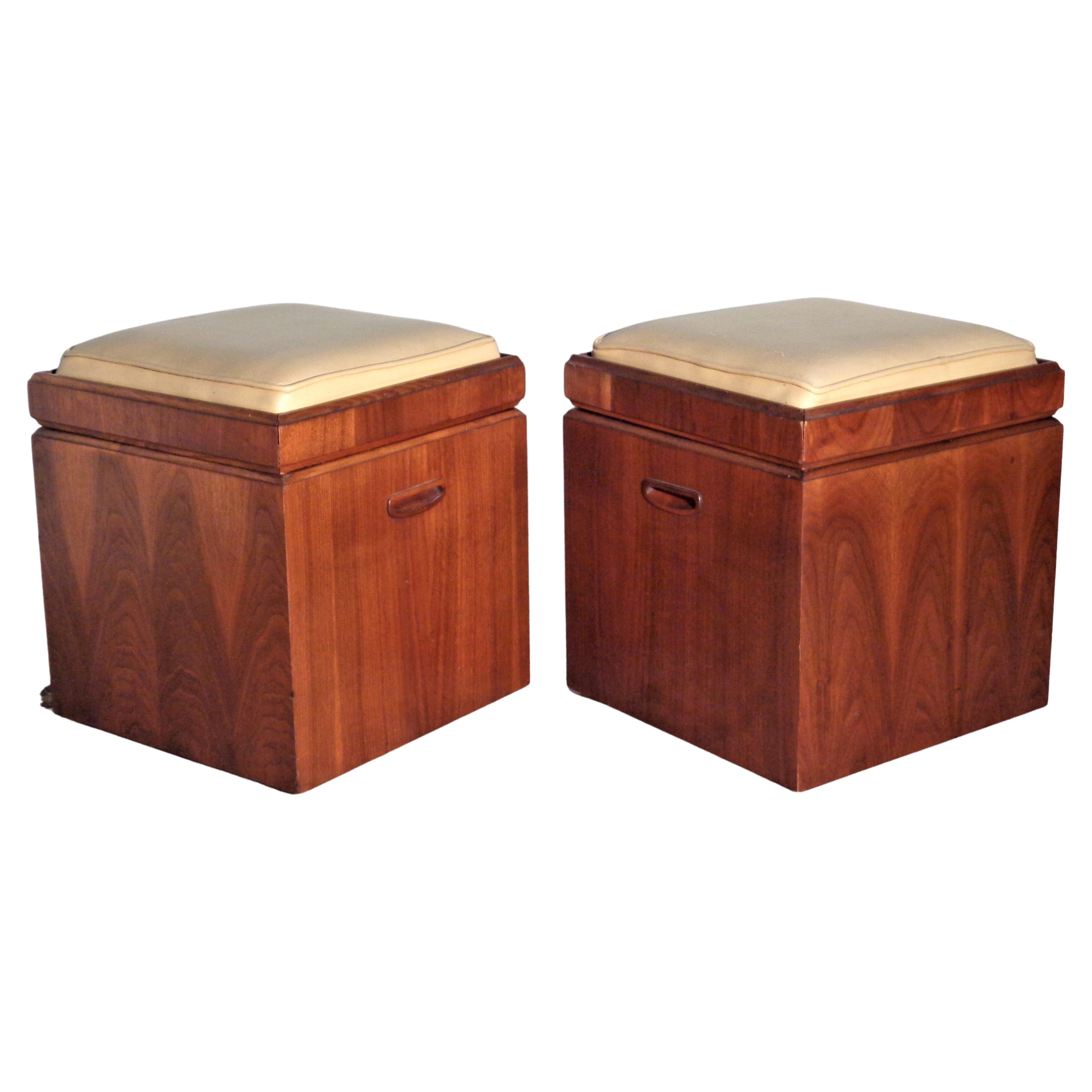 Pair of beautifully figured walnut veneer faux leather upholstered seat flip top cube ottomans with chess boards / checker boards on underside of seat / wide open interiors for storage and the original small rolling casters on bottom. Stamped Lane