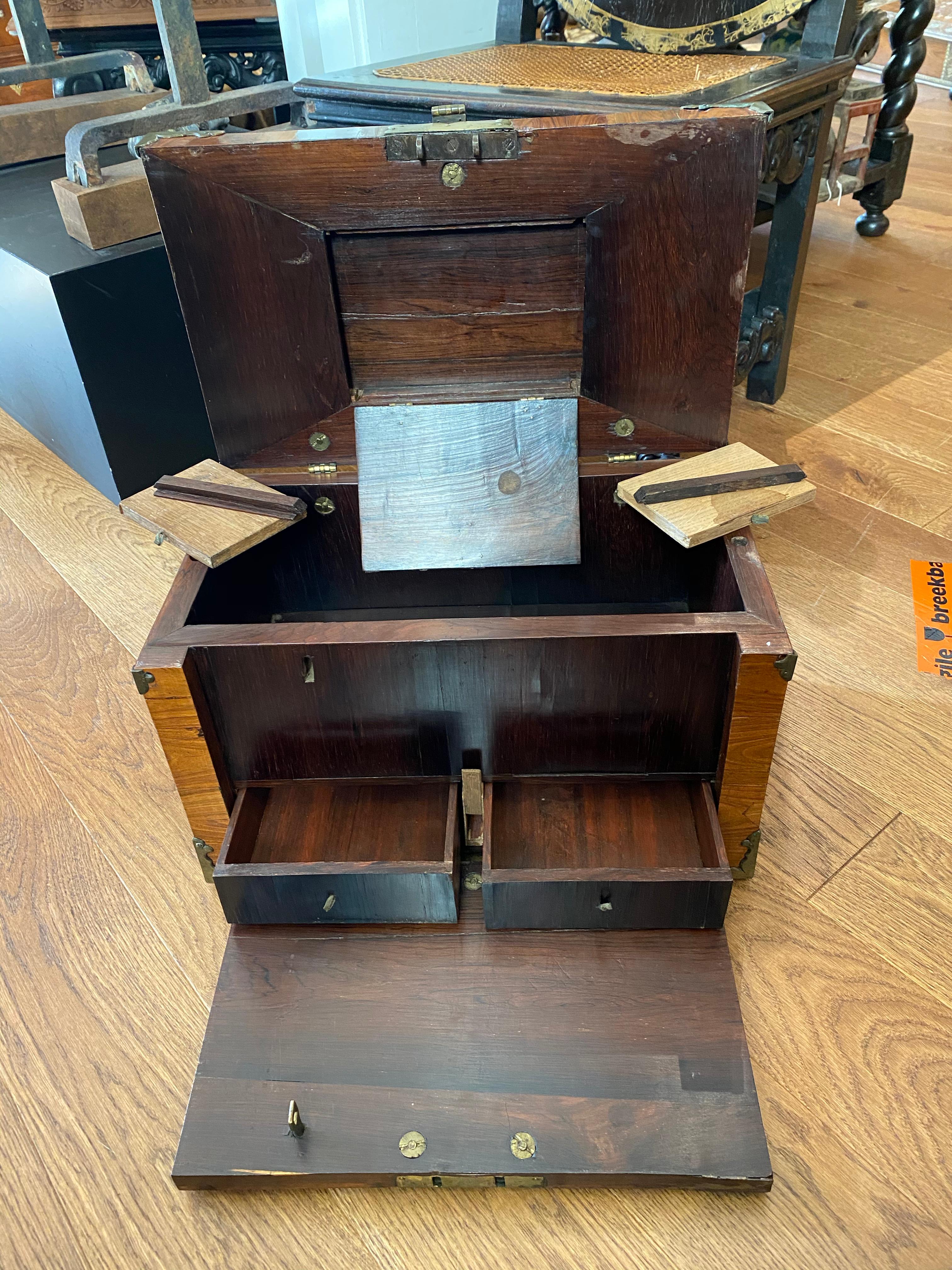 A walnut veneer on oak strong box (Coffre Fort) or 'captain's chest with brass mounts

North-West Europe, late 17th century
 
Behind the fall front two drawers with secret boxes above, on the underside of the lid, behind a flap a space for small