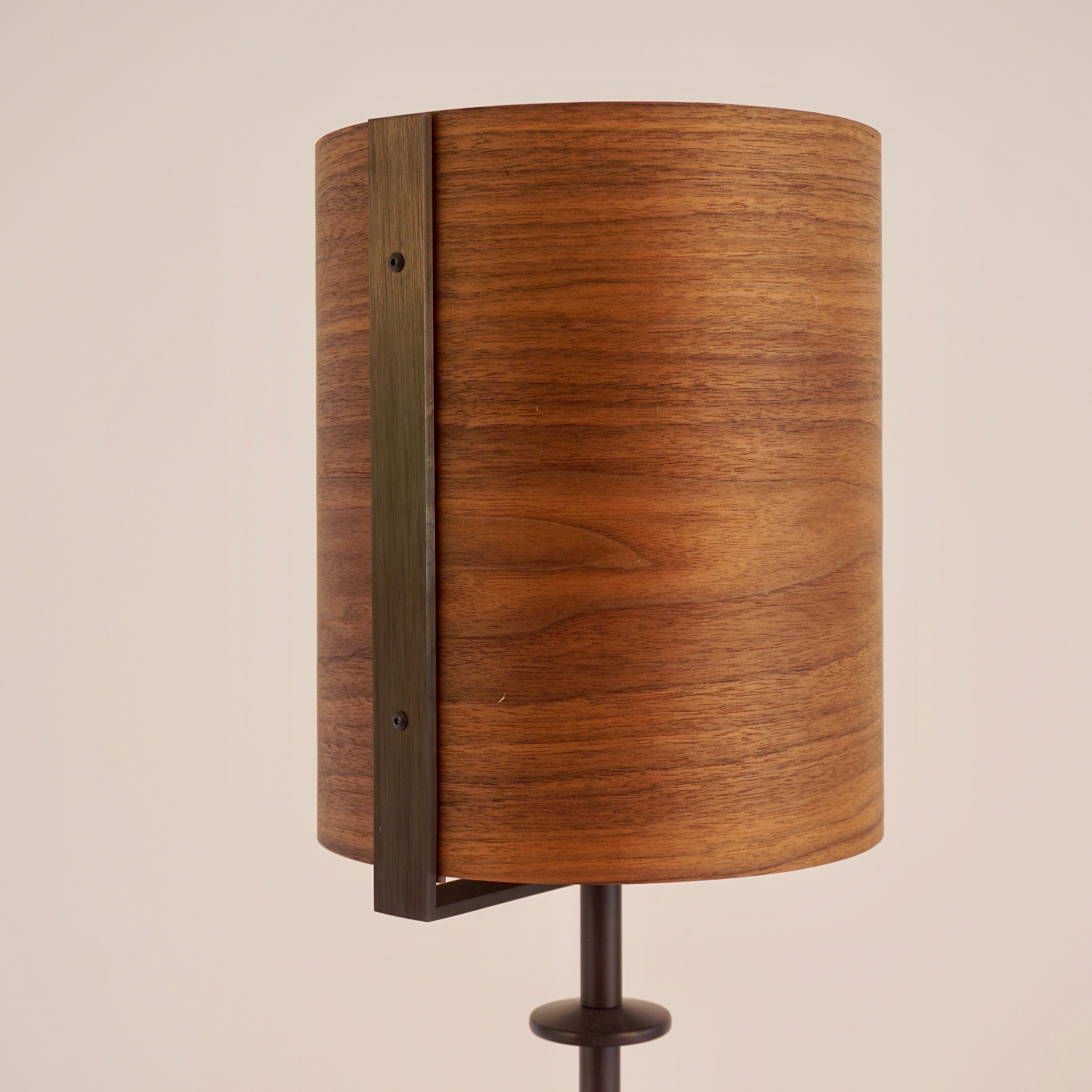 The walnut veneer lamp #4 is part of the original Lehrecke Veneer Lighting Collection from 1998. The idea began with the beautiful way light came through thin wood veneers, many being local woods. The walnut has a beautiful dark brown color typical