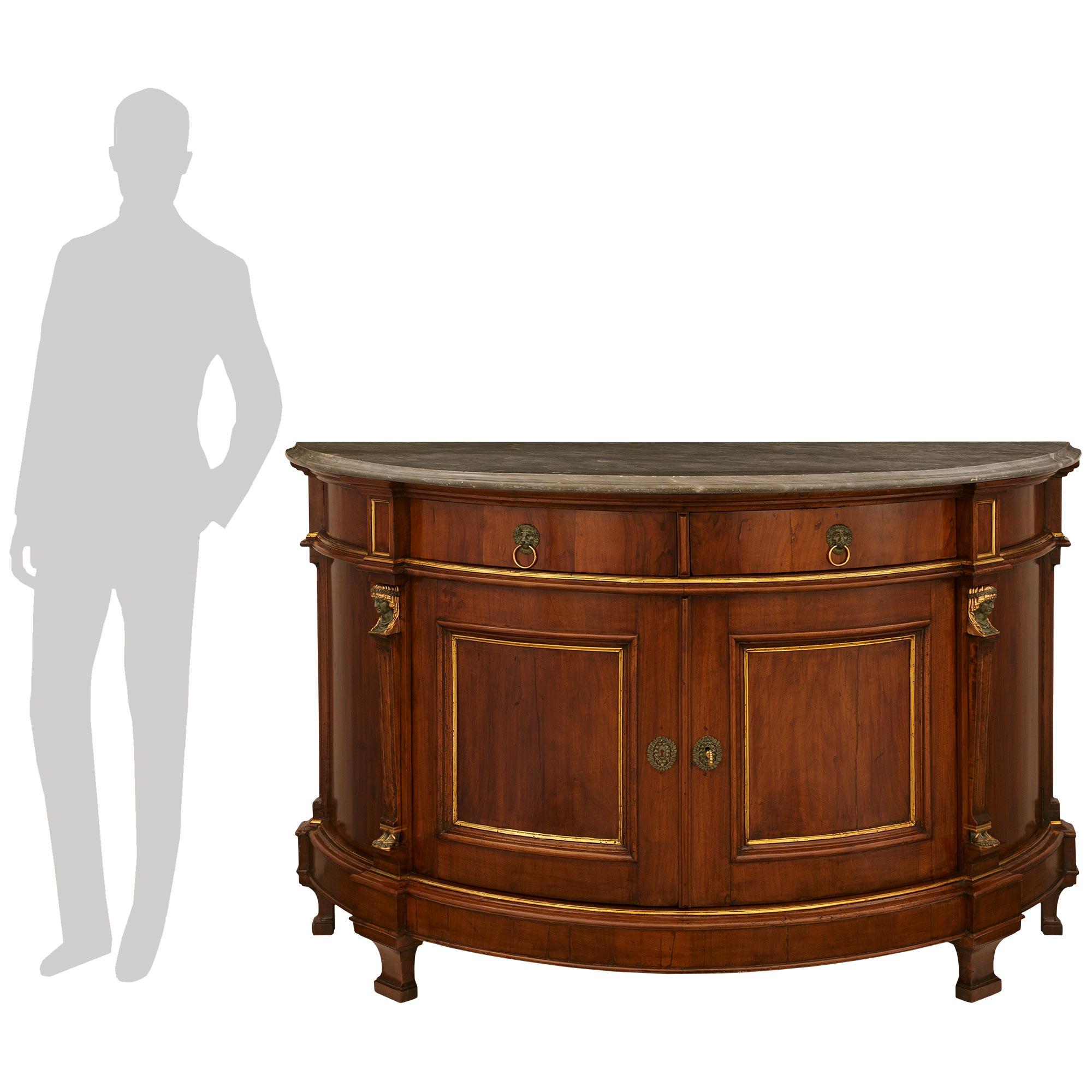 A sensational and most impressive Italian 18th century Neo-Classical st. Walnut, Verdigris Bronze, Giltwood and and Gris St. Anne marble cabinet. This handsome demi lune shaped cabinet is raised on four scrolled block feet below the mottled designed