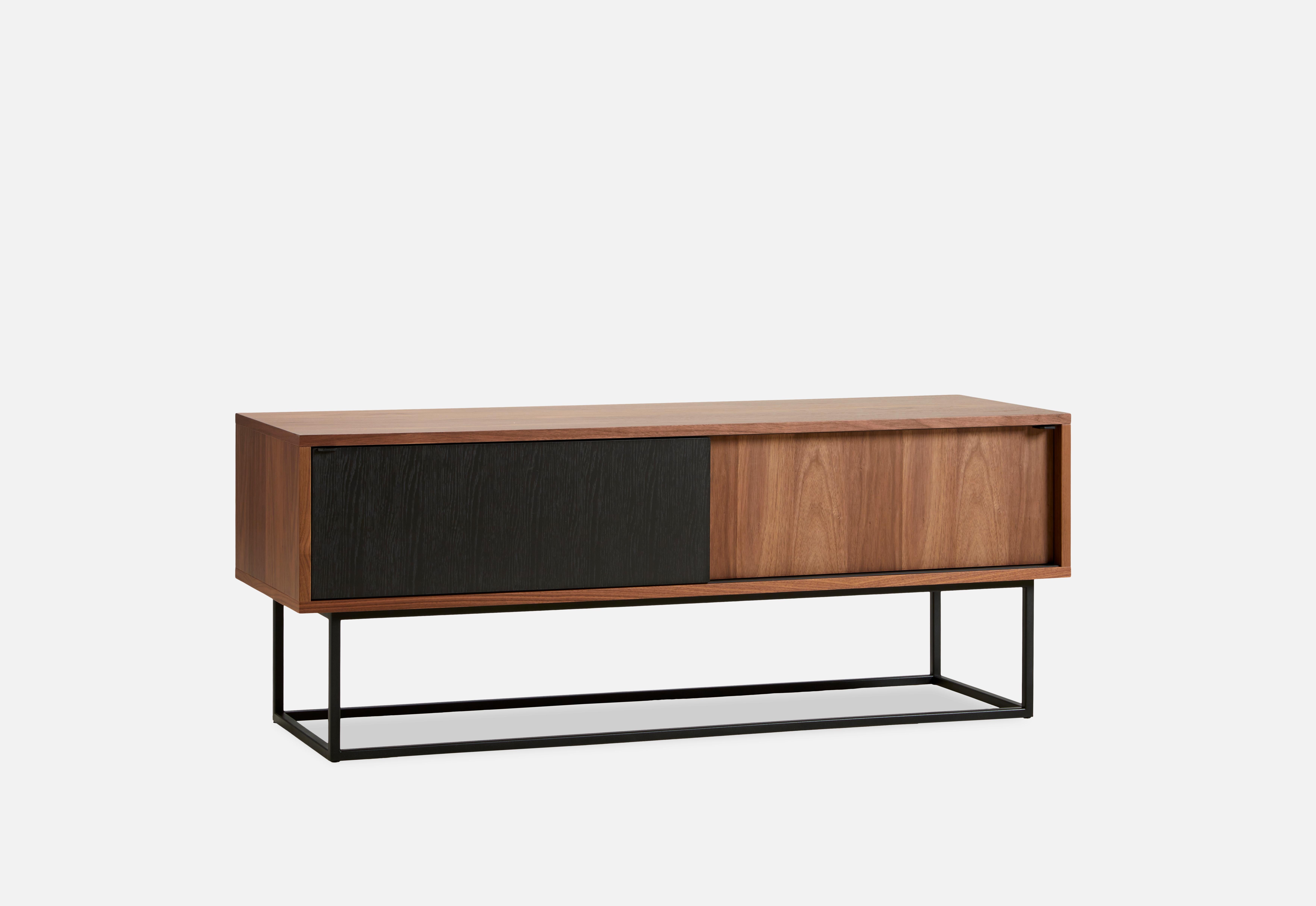 Walnut virka low sideboard by Ropke design and Moaak.
Materials: walnut, metal.
Dimensions: D 40 x W 120 x H 47 cm.
Also available in different colours and materials.

The founders, Mia and Torben Koed, decided to put their 30 years of