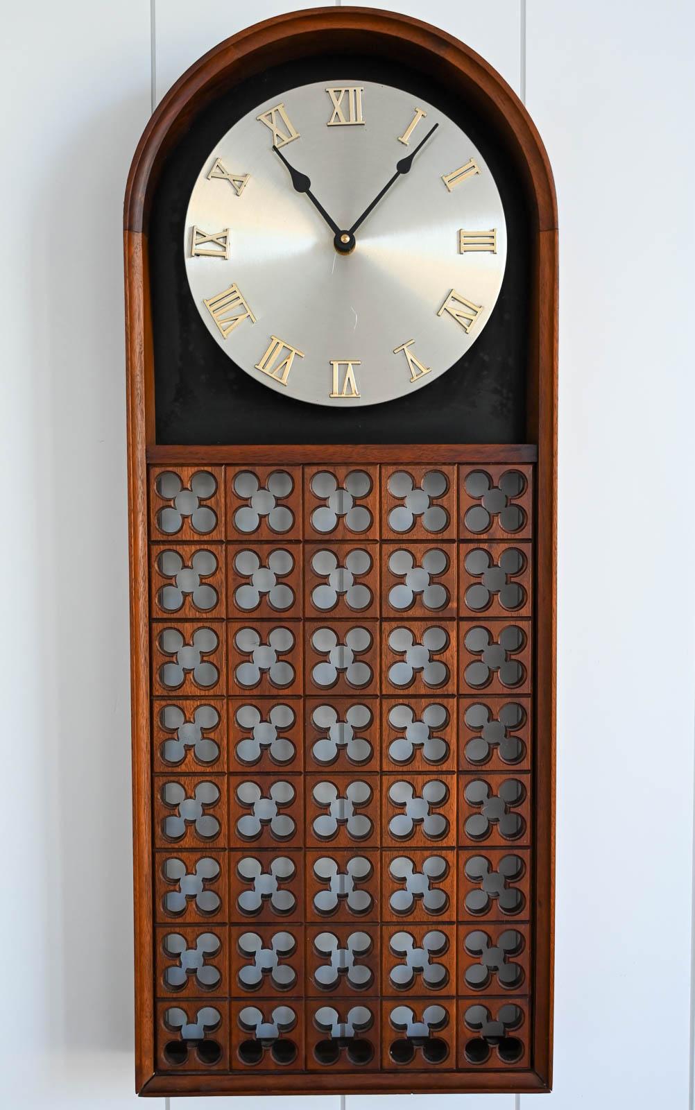 Walnut Wall Clock by Arthur Umanoff for Howard Miller, ca. 1970. Meridian Clocks design line. Designed by Arthur Umanoff Assoc. Walnut Case. Battery operated clock work. Metal clock face and hands. Excellent working condition.  George Nelson