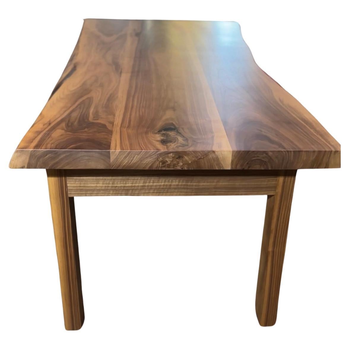 Walnut waney edge dining table For Sale