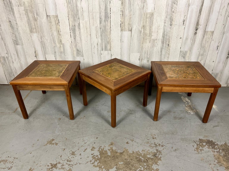 Set of three solid walnut with copper tile top tables by John Keal for Brown Saltman.