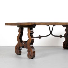 Walnut wood bench with lyre-shaped legs and wrought iron fasteners