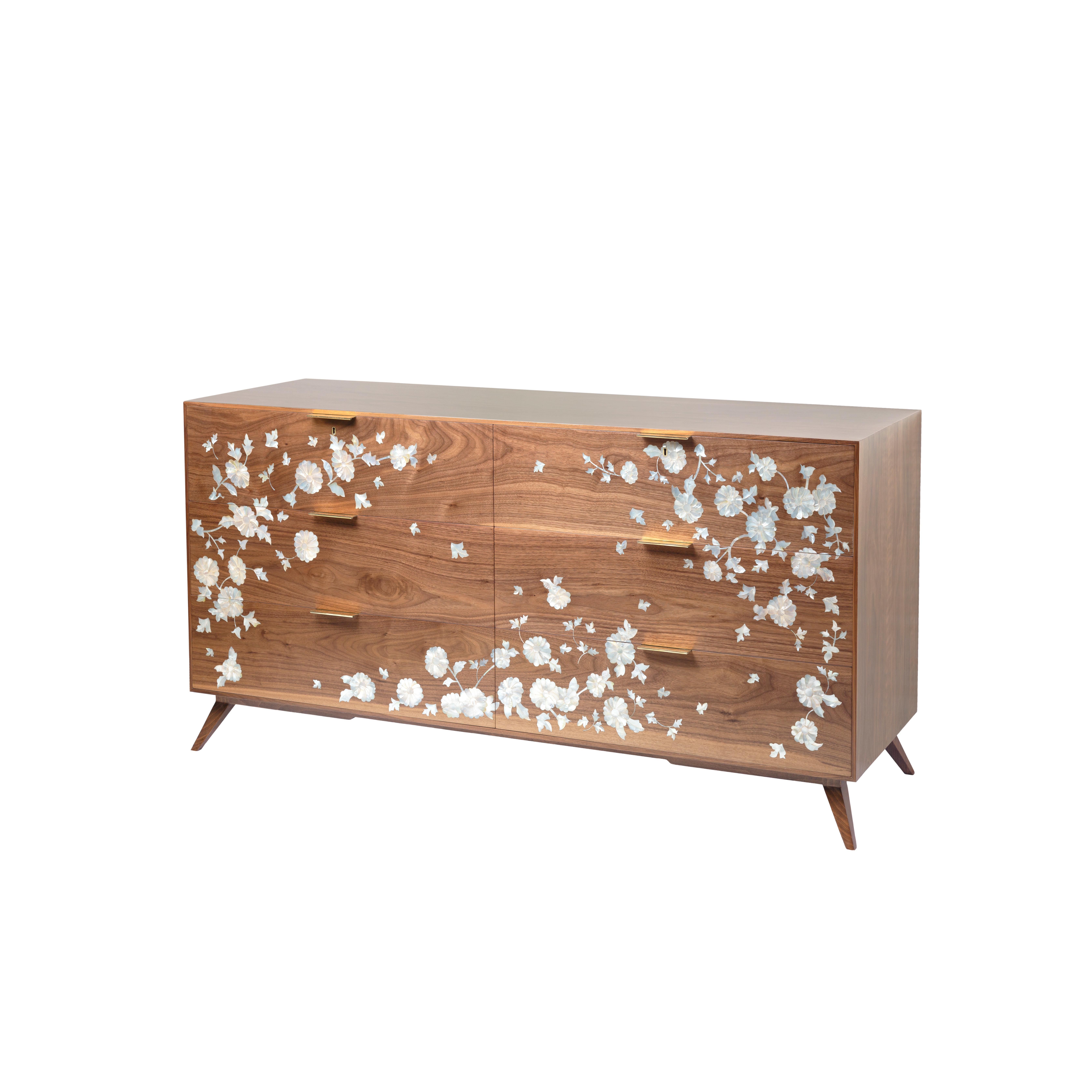 Walnut Wood Chest of Drawers with Hand-Laid Mother-of-Pearl in Delicate Floral Design. 
If you are looking for an iconic piece to beautify a space in your bedroom or guest room, and also bring happiness, this chest of drawers will do the works! It