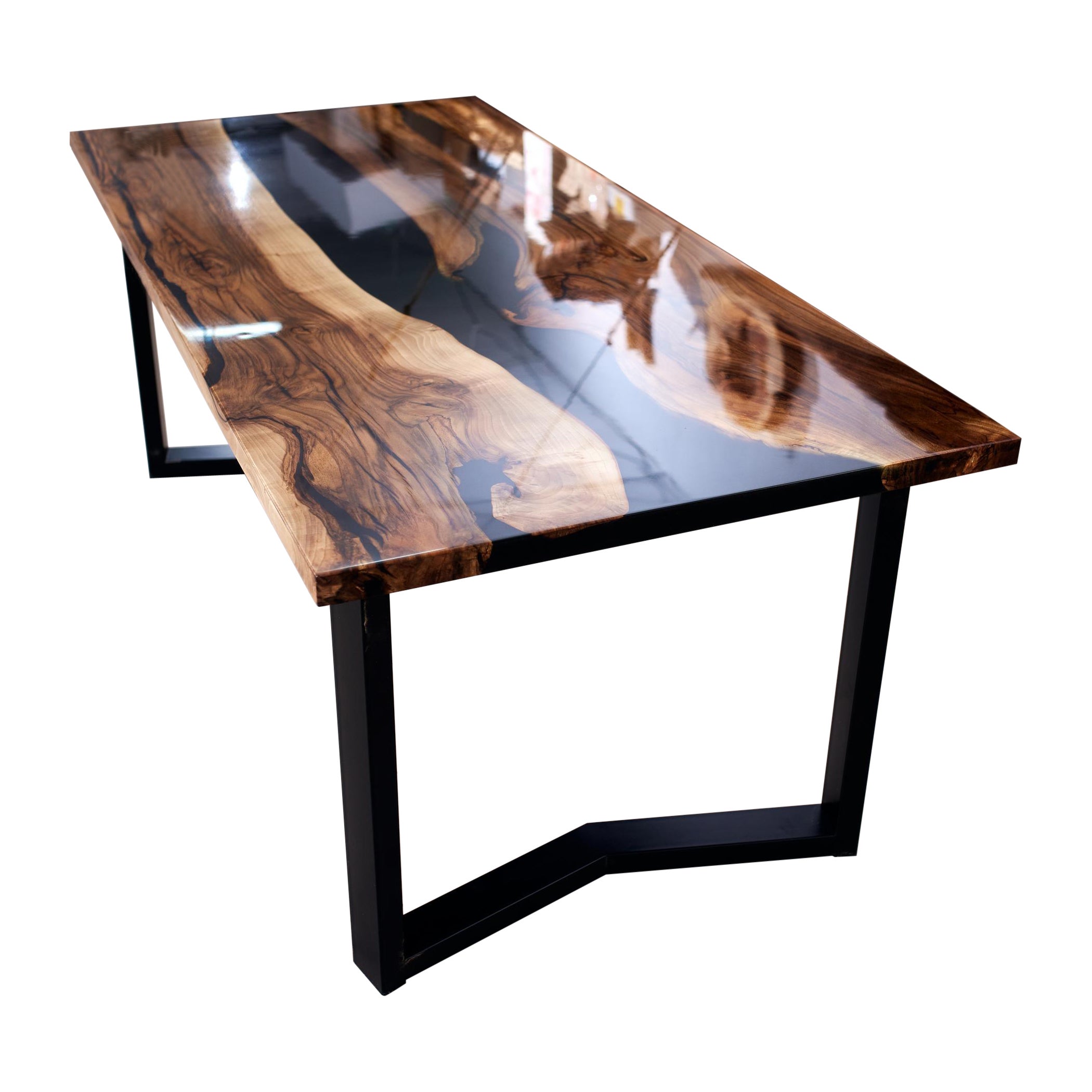 The Sorrow
Ancient slabs of rotten walnut shrouded in the darkness of black epoxy. Every crack and every authentic feature of the old wood is accentuated with pitch black as darkness itself. The table turned out with its own special character. I am