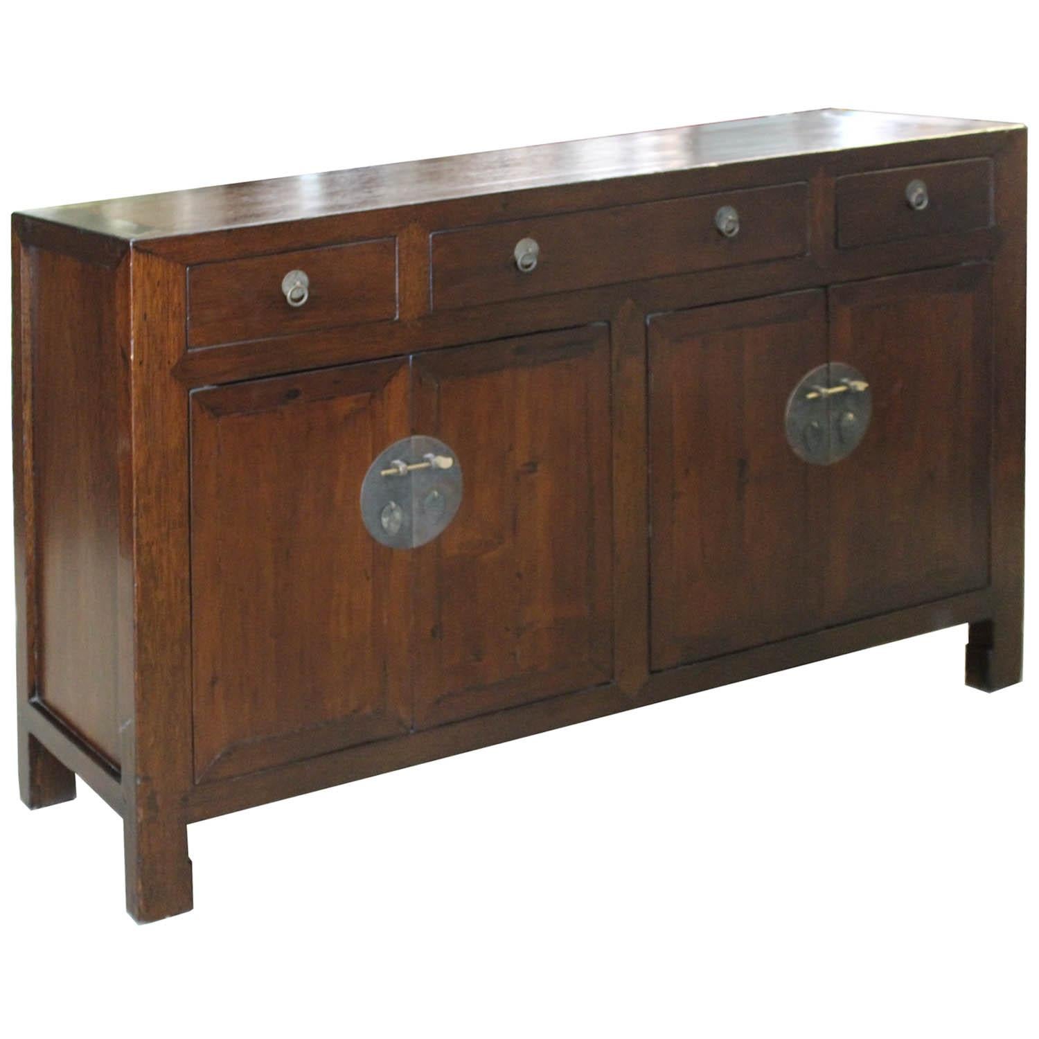 Classic four-drawer walnut wood sideboard with two sets of doors. Place in the living room beneath a flat screen tv or in the dining room. New interior shelf and hardware.
