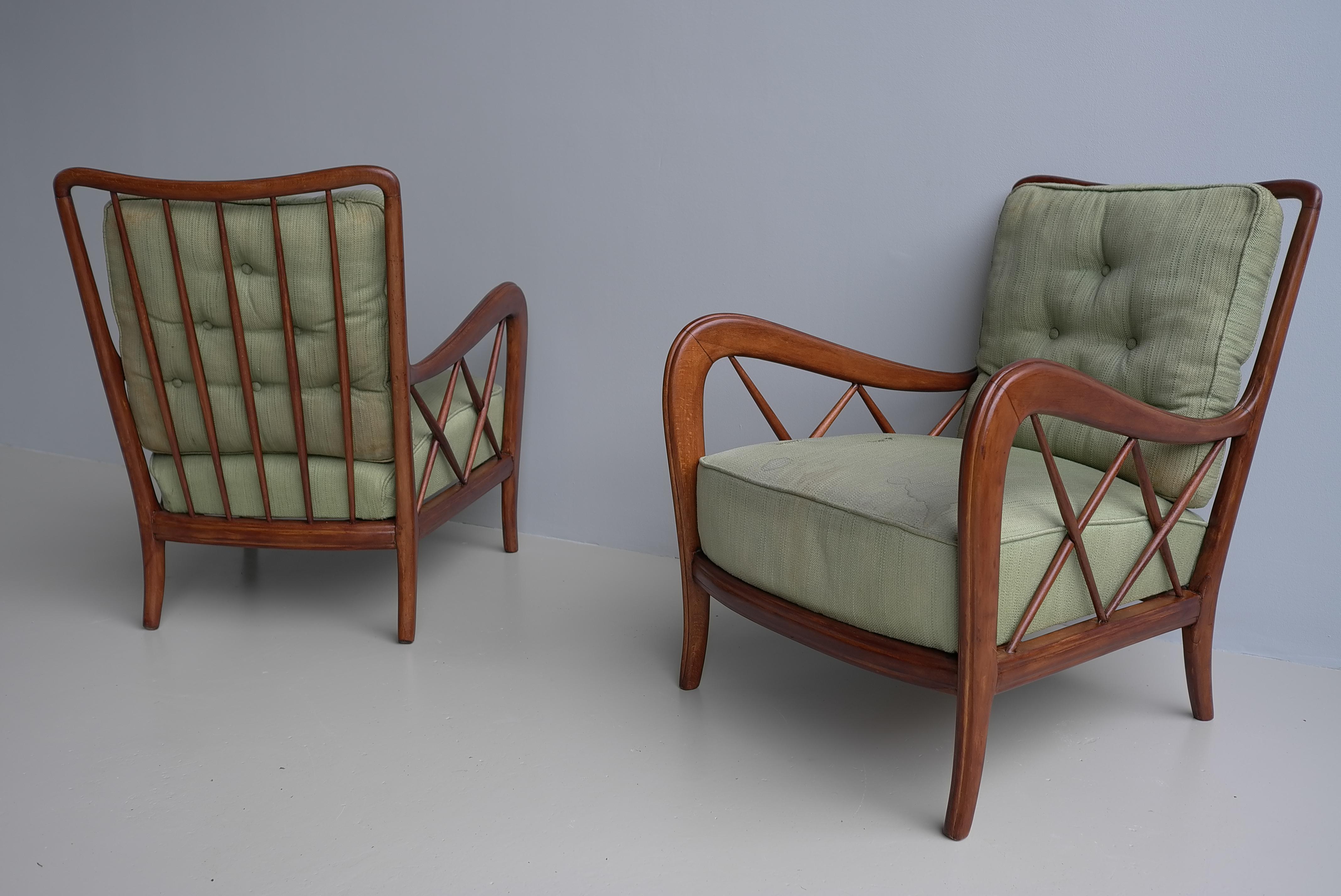 Pair of arm Chairs with curled and cross -shaped armrests, curly backrests with vertical struts. 

These chairs we have attributed to Paolo Buffa but they are always sold as designed by Paolo Buffa. So probably designed by Paolo Buffa we prefer to