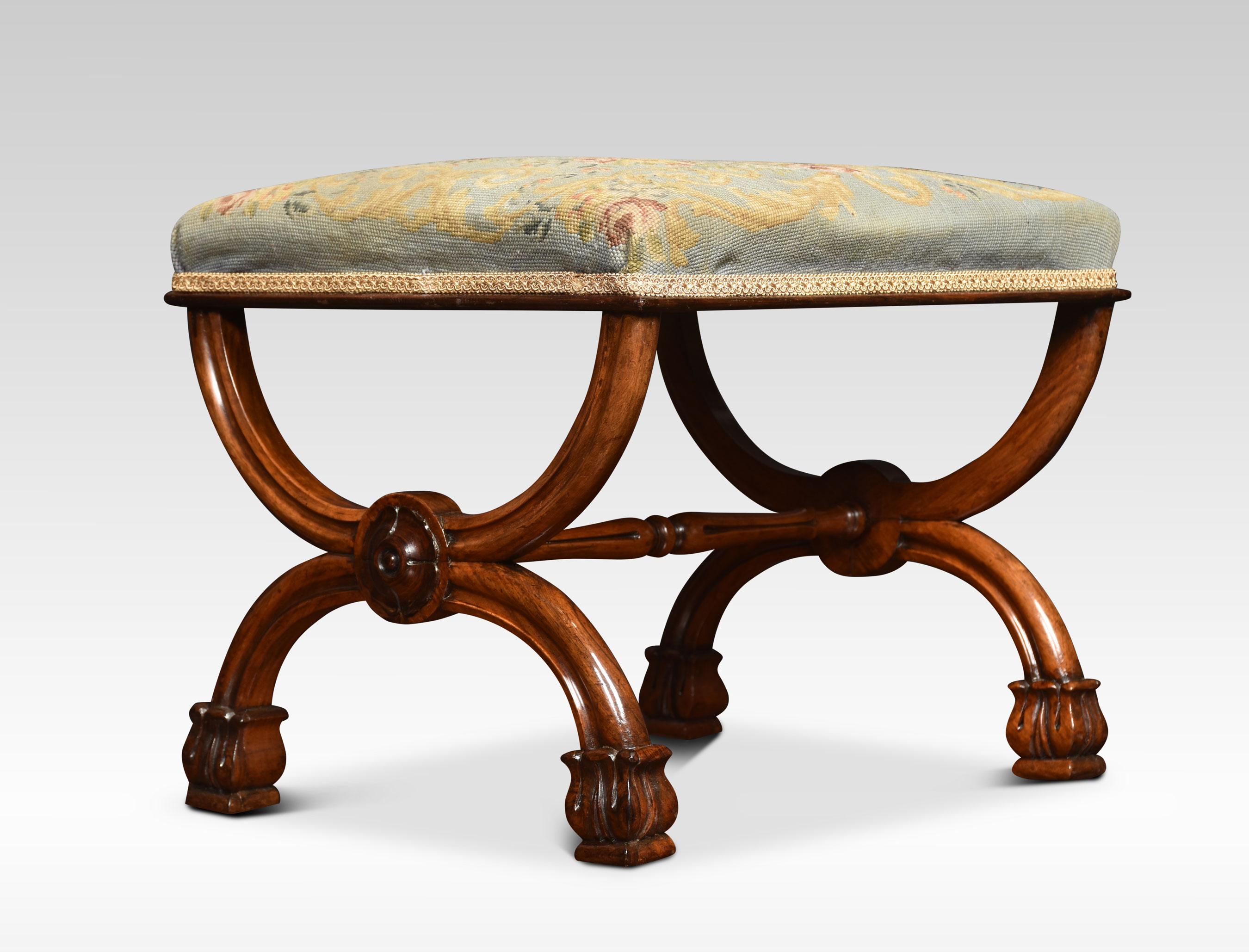 Early 19th century walnut X-frame stool, the needlepoint seat over the moulded frame with a turned stretcher on floral carved feet inited by stretcher.
Dimensions
Height 18 Inches
Width 22 Inches
Depth 18.5 Inches