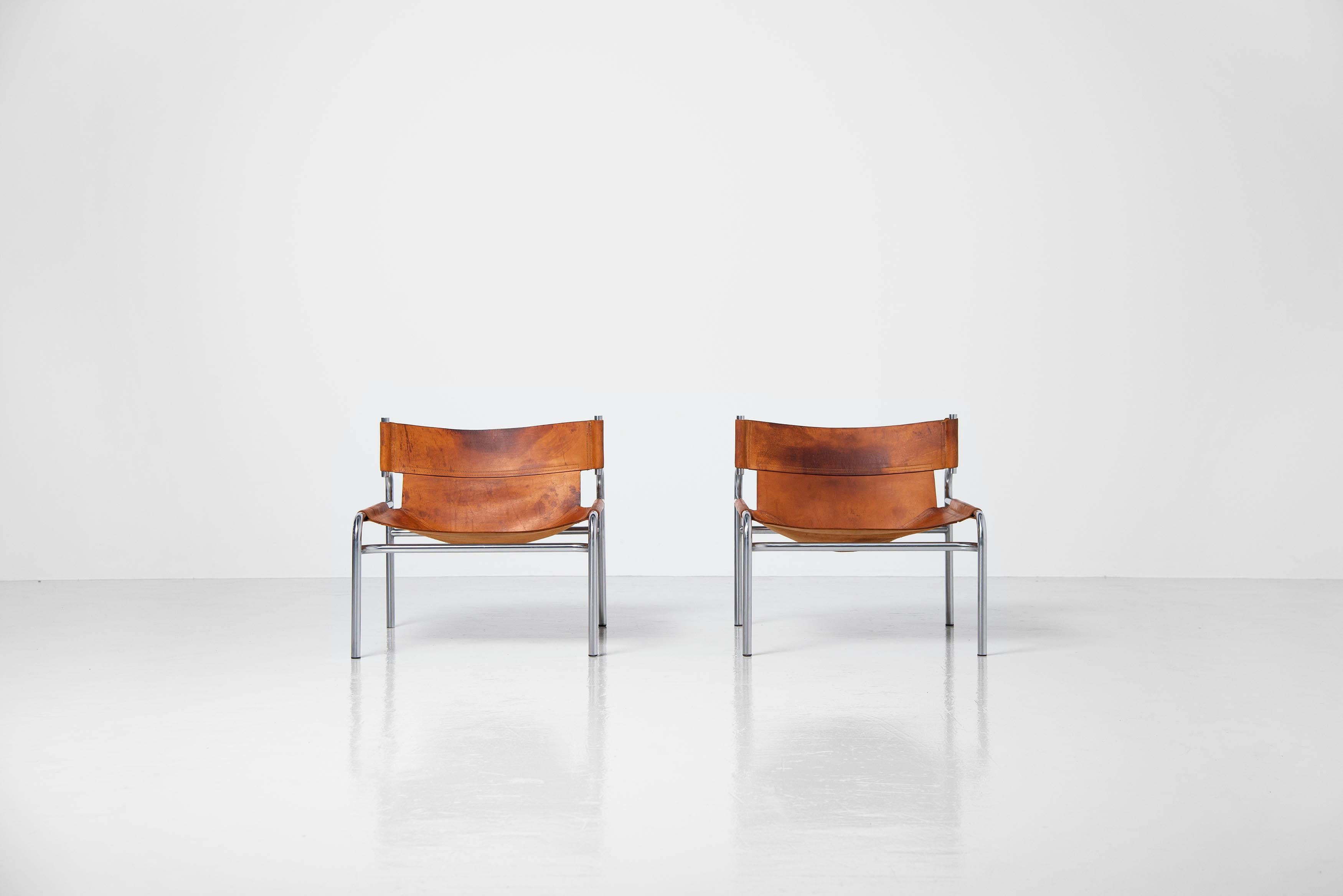 Beautiful patinated pair of low lounge chairs model SZ12 designed by Walter Antonis and manufactured by 't Spectrum Bergeijk, Holland 1971. These chairs were in the collection from 1971-1974, so not many were made. These very nice and unusual shaped