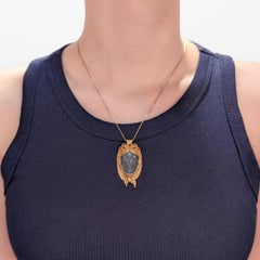 Walter Bauscher 14K Gold, Rock Crystal, Garnet, and Diamond Figural Face Pendant
