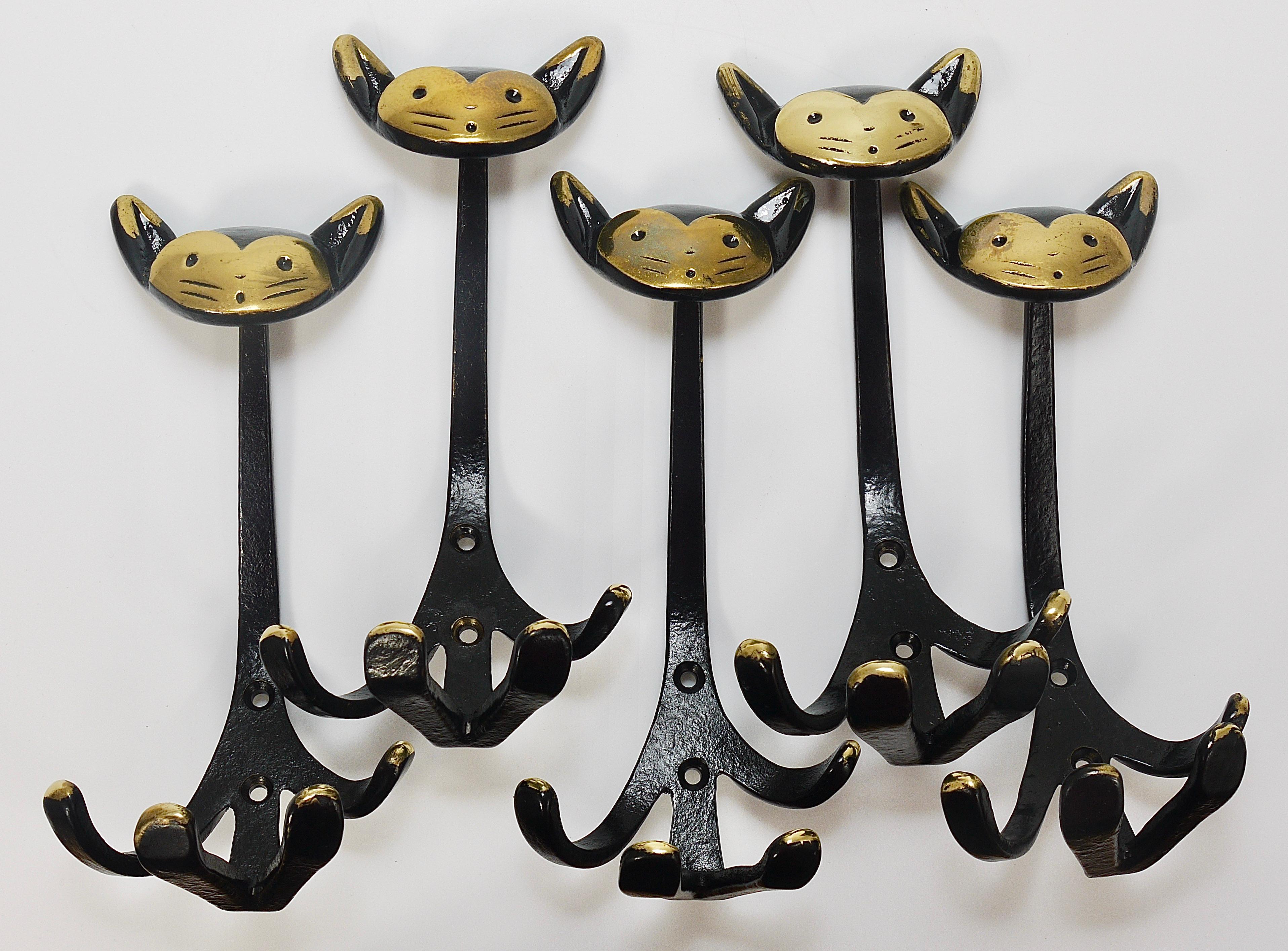 Up to five lovely Austrian modernist animal zoo coat wall hooks, displaying a cat, our favourite hook. The hooks are sold and priced per piece. A humorous design by Walter Bosse, executed by Herta Baller, Vienna / Austria in the 1950s. Made of black