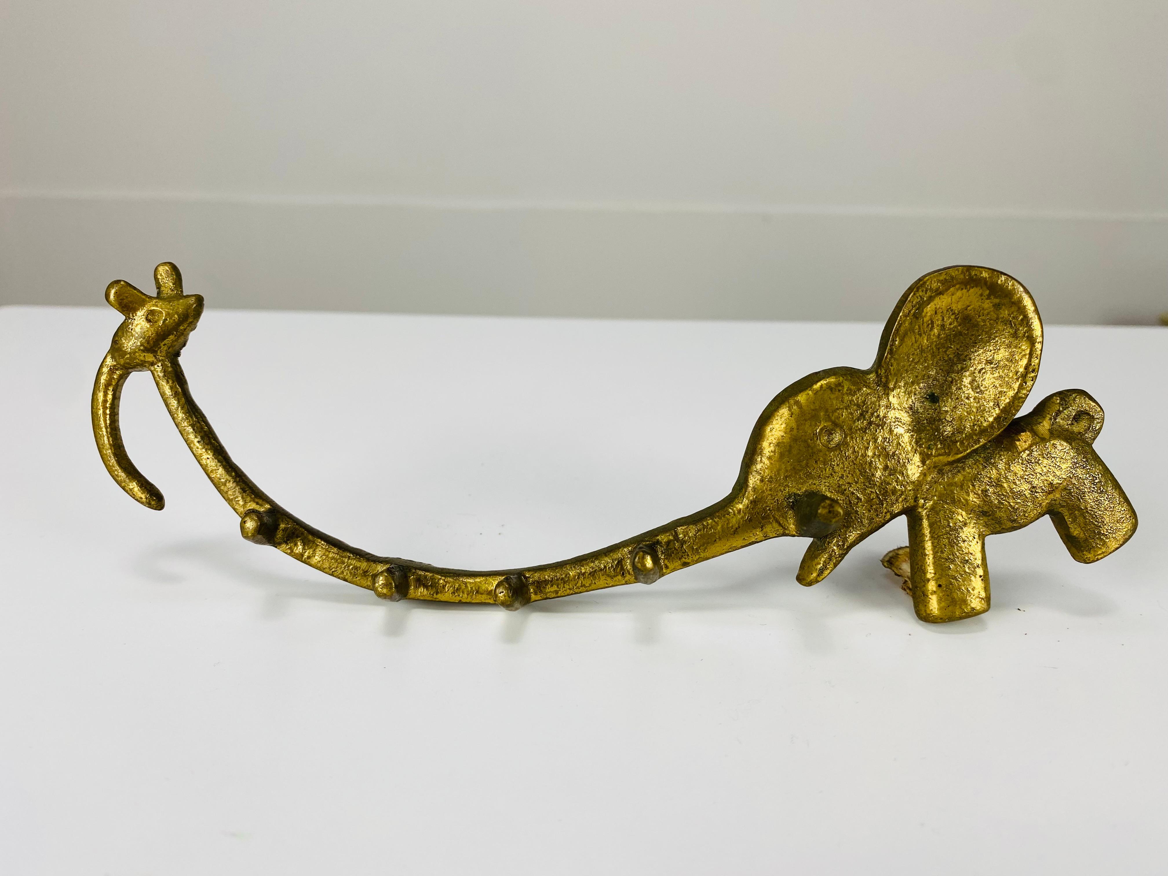 Rare mid-century key hanger by Walter Bosse, displaying an elephant and a mouse. This item is made of brass and is in very good condition. It was made by Herta Baller in Austria in the 1950's. 