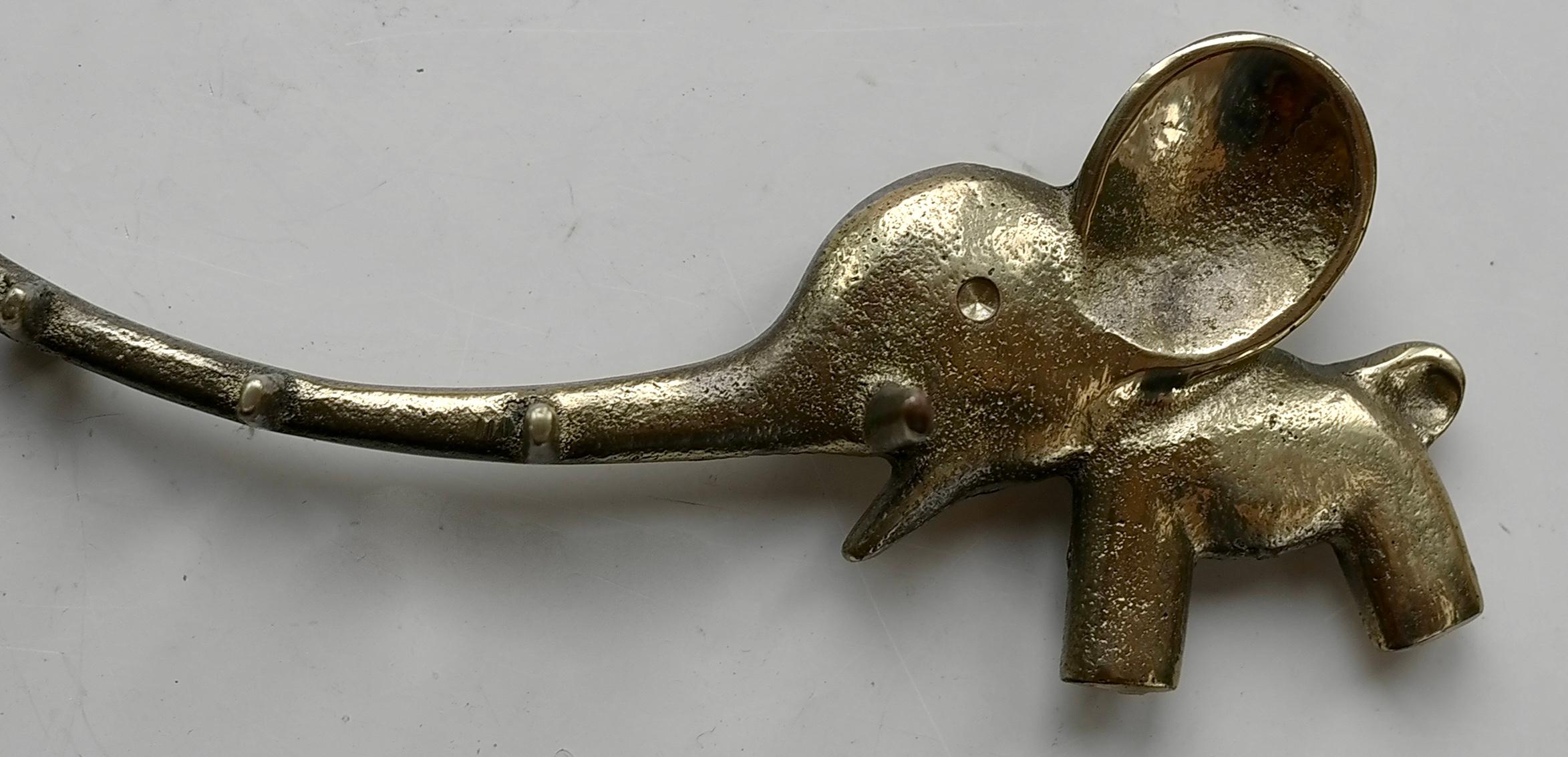 A charming and rare vintage midcentury key holder, displaying an elephant and a little mouse. A very humorous design by Walter Bosse, executed by Hertha Baller Austria in the 1950s. Made of brass, in very good condition. Also suitable as a towel