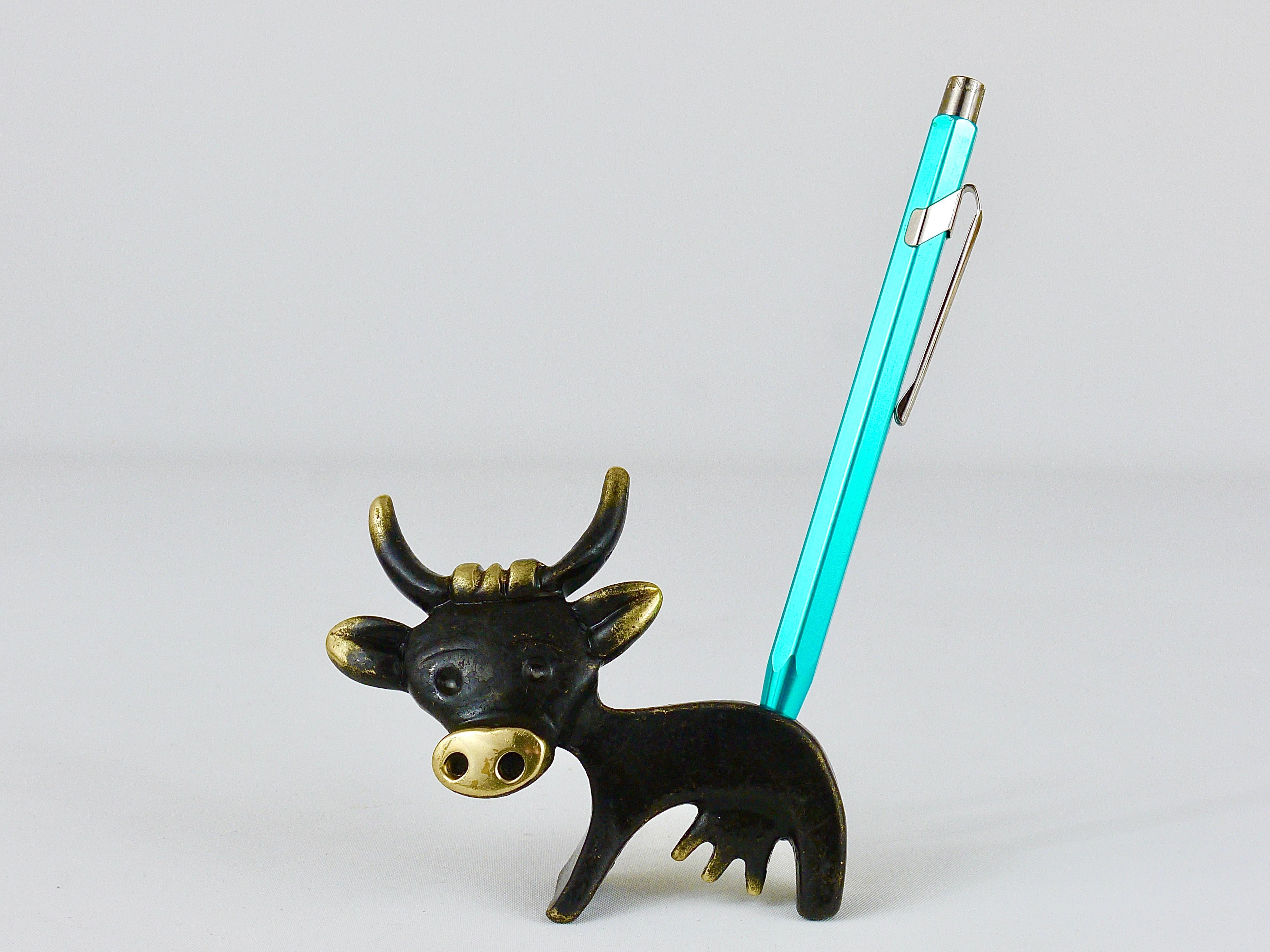 A very charming Austrian midcentury pen or pencil holder sculpture, displaying a cow. A very humorous design by Walter Bosse executed by Hertha Baller Austria in the 1950s. Made of brass, in good condition with charming patina.