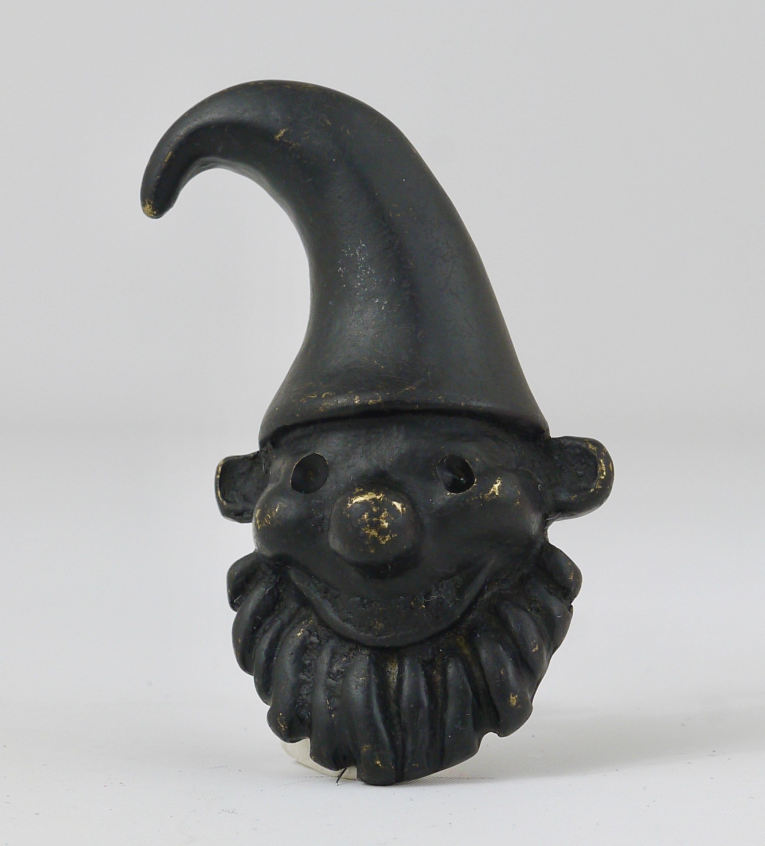 A charming midcentury bottle opener/cork screw, displaying a dwarf. A humorous design by Walter Bosse, executed by Hertha Baller Austria in the 1950s. Made of black-finished brass, in good condition.