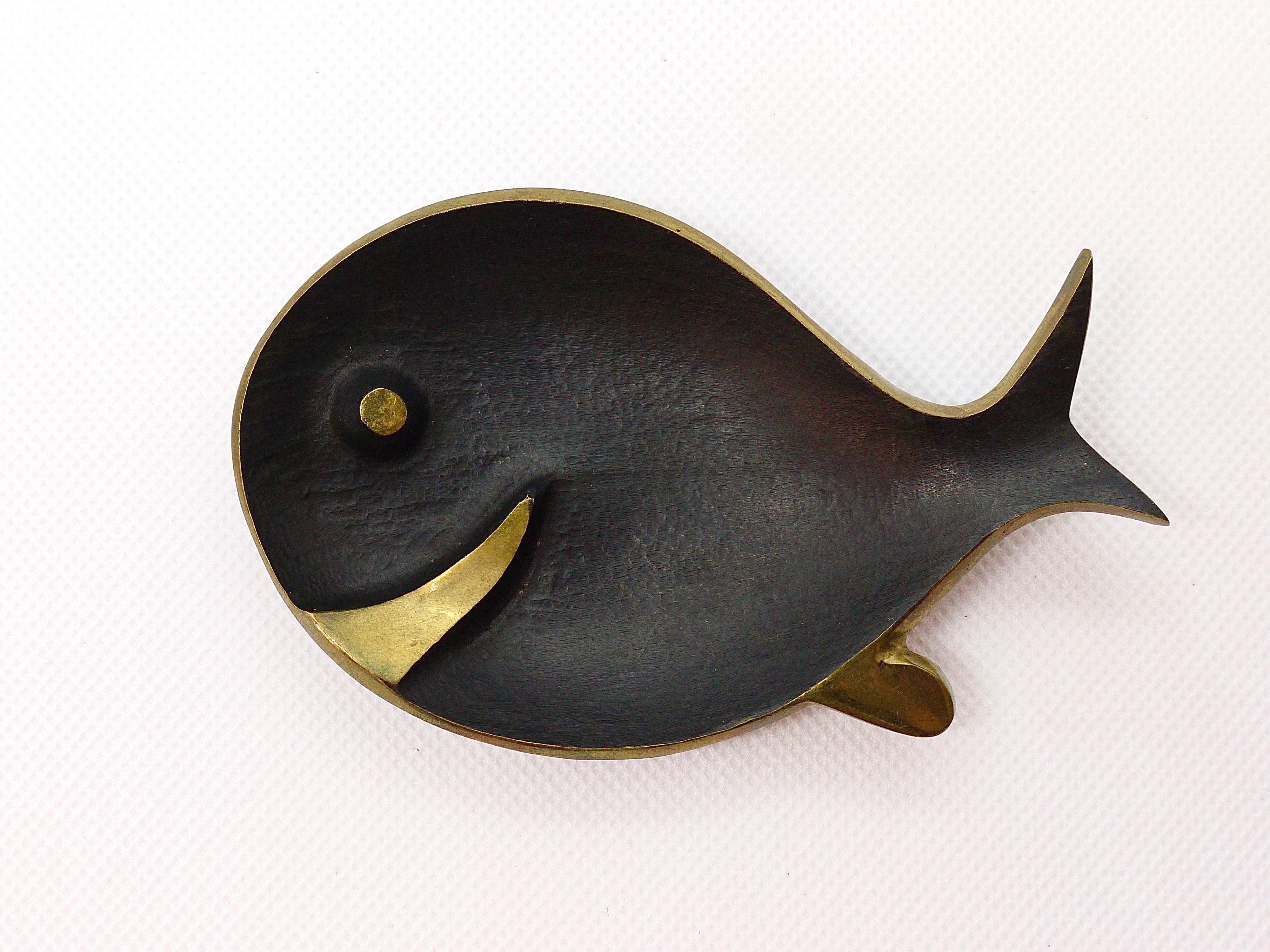 A charming modernist bowl or ashtray in the shape of a fish. A very humorous design by Walter Bosse, executed by Hertha Baller Austria in the 1950s. Made of brass, in excellent condition. Marked.