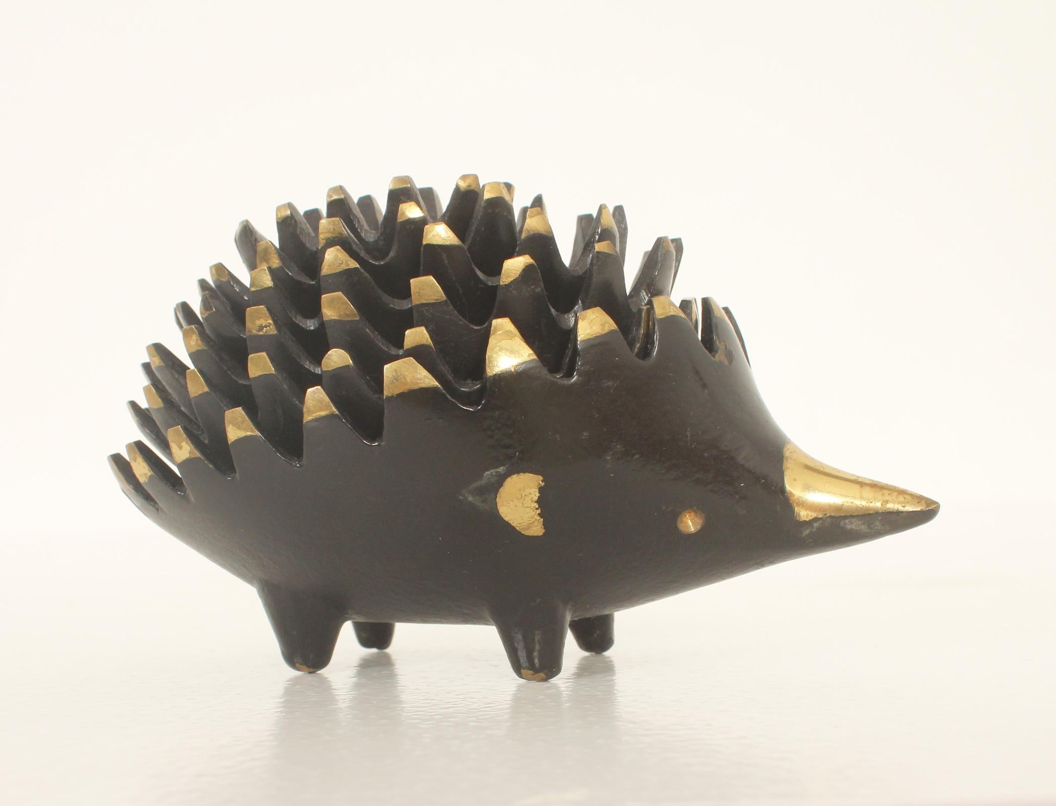 Set of six stackable ashtrays in the shape of a hedgehog designed in 1955 by Walter Bosse for Hertha Baller, Austria. Polished and patinated brass. 