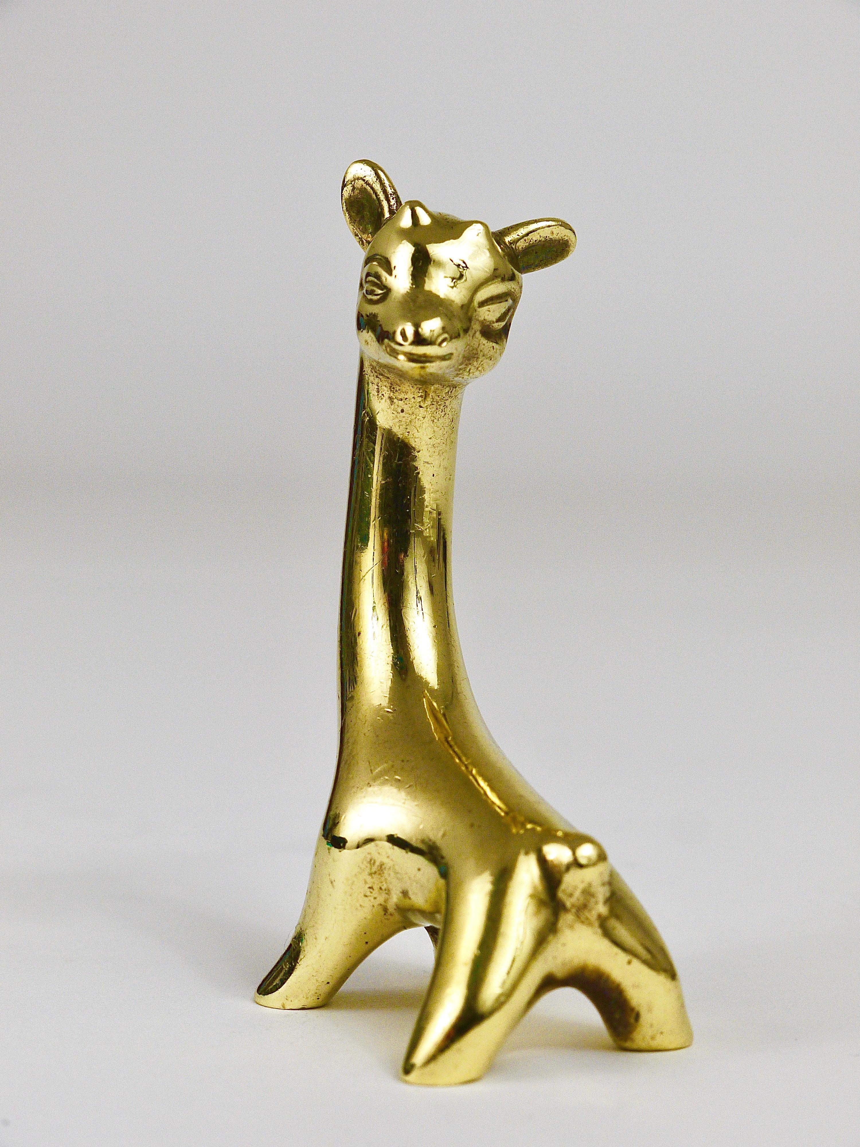A lovely baby giraffe sculpture made of brass from the 1950s. Designed by Walter Bosse, executed by Herta Baller, Austria. In very good condition with marginal patina.