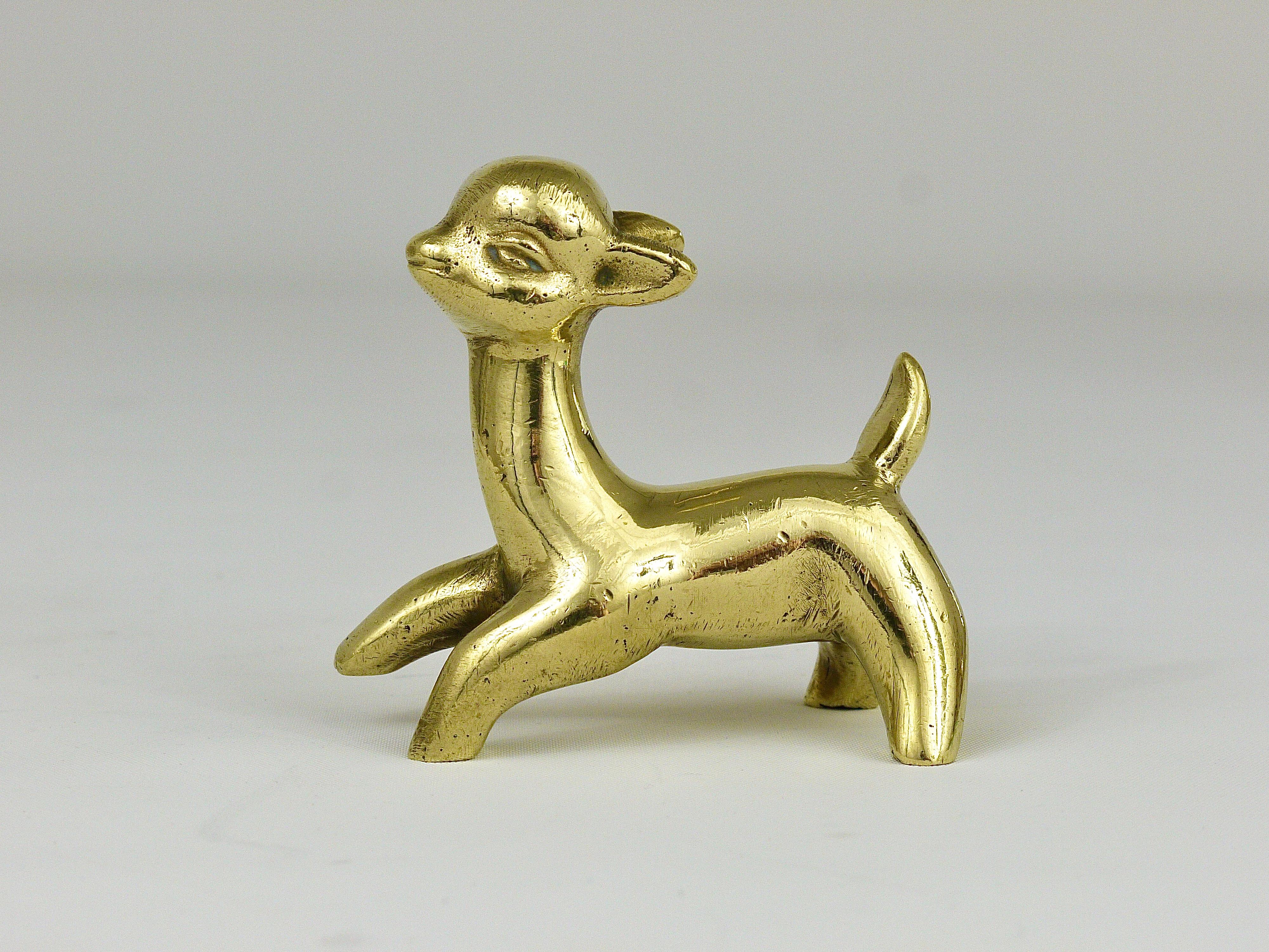 A lovely fawn / baby deer sculpture made of brass from the 1950s. Designed by Walter Bosse, executed by Hertha Baller, Austria. In good condition with nice patina.