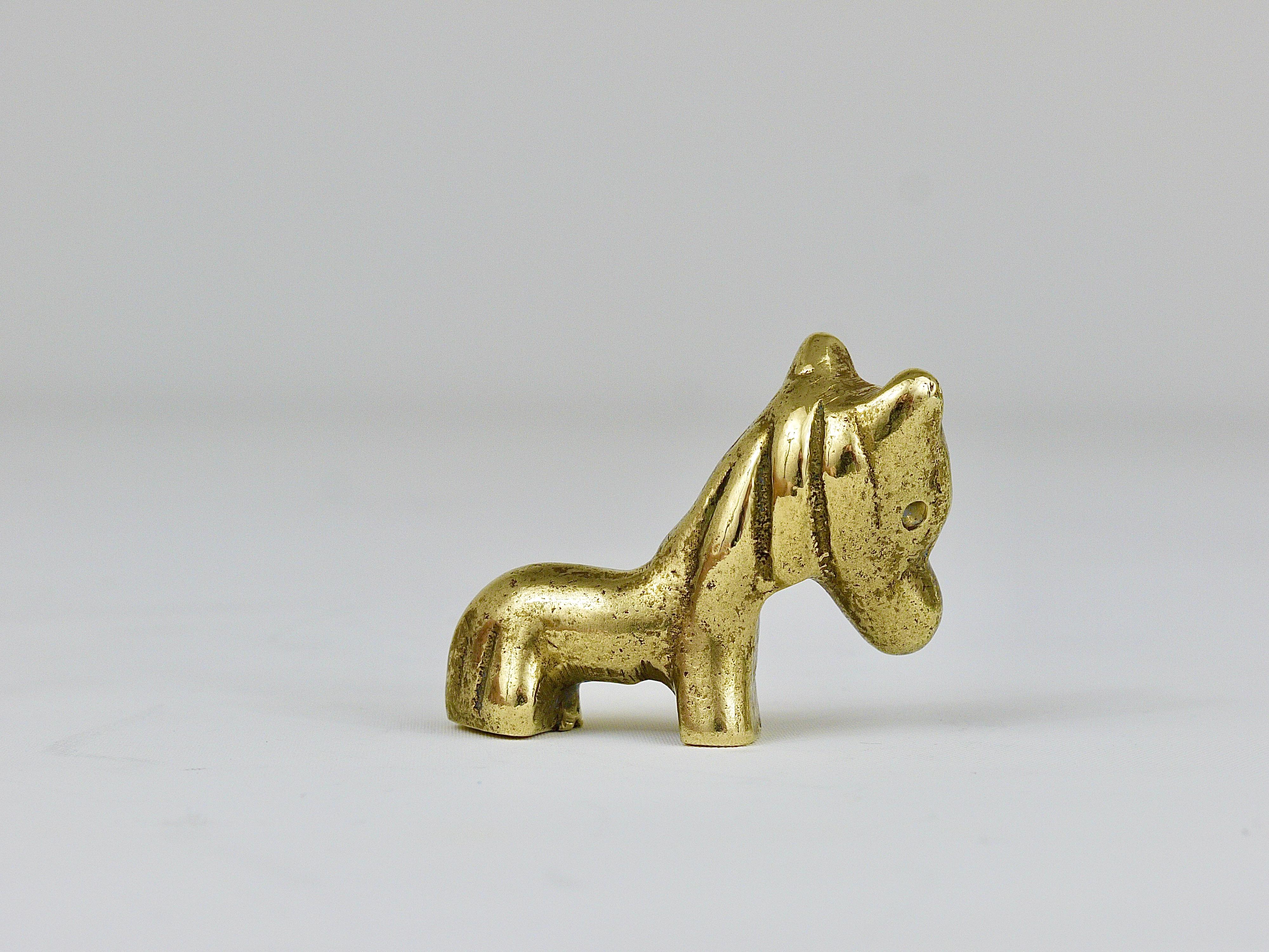 A lovely pony foal baby horse sculpture made of brass from the 1950s. Designed by Walter Bosse, executed by Hertha Baller. In good condition with nice patina on the brass.